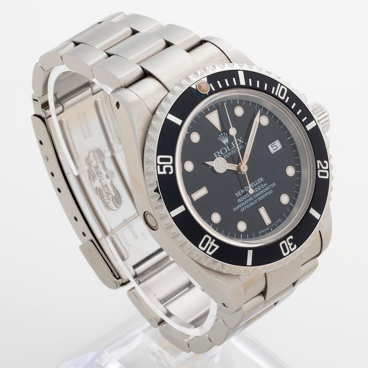 Our neo - vintage Rolex Sea-Dweller , reference 16600 , features its original tritium dial with matching hands, and greyish original bezel insert with patinated pearl giving a great vintage appearance for a classic Rolex sports watch. Presented in