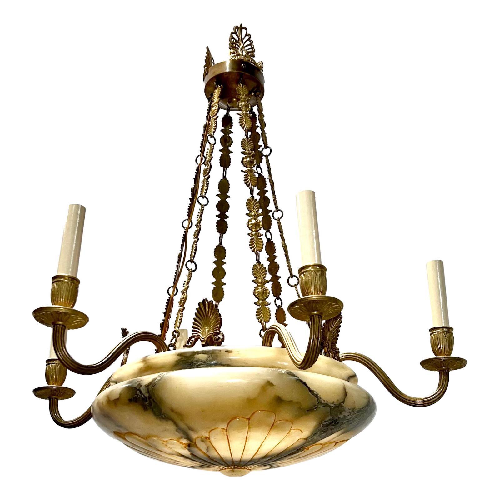 A circa 1920's French gilt bronze and alabaster eight-arm chandelier.

Measurements:
Current drop: 39