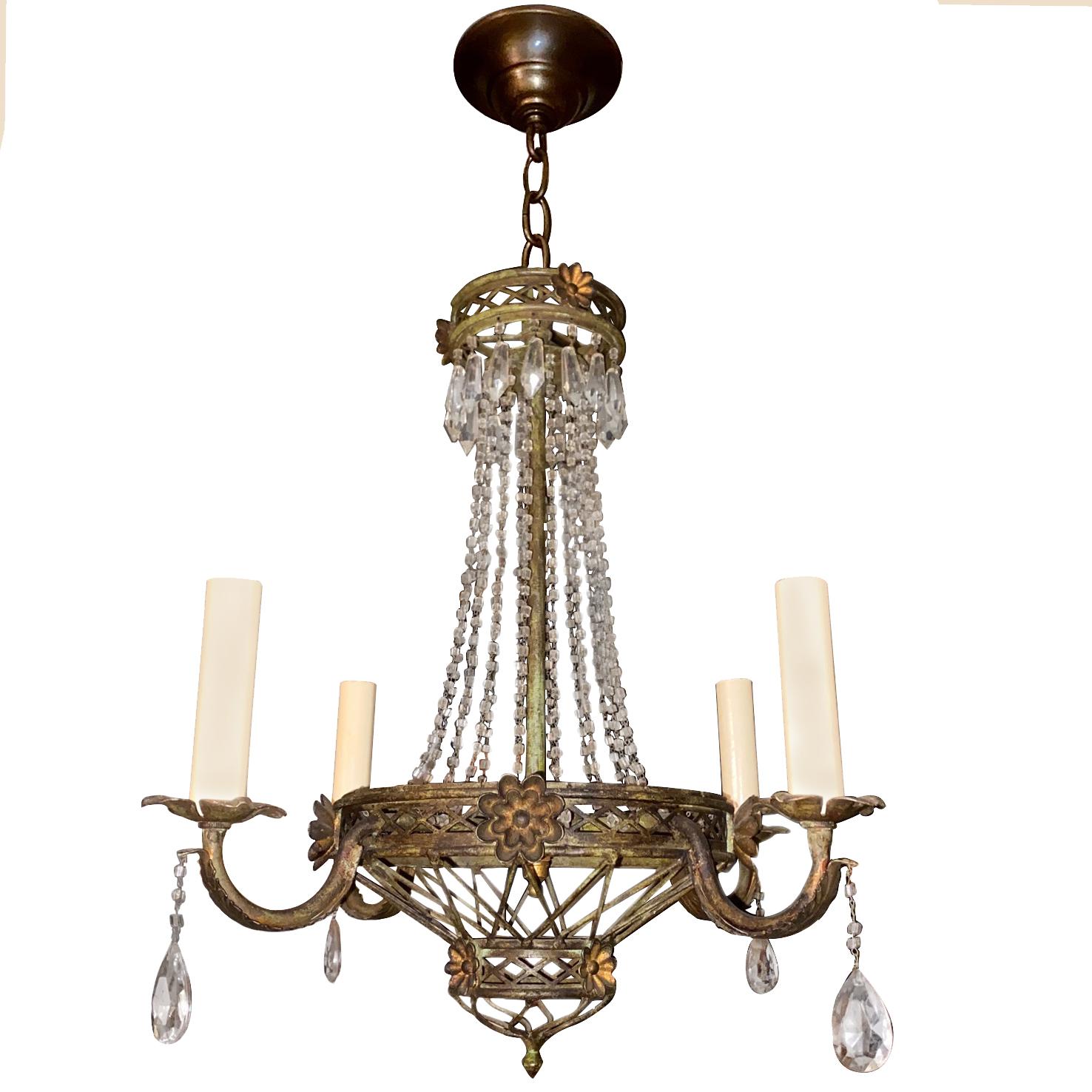 A circa 1950s French painted tole chandelier with crystal drops.

Measurements:
Present drop 24