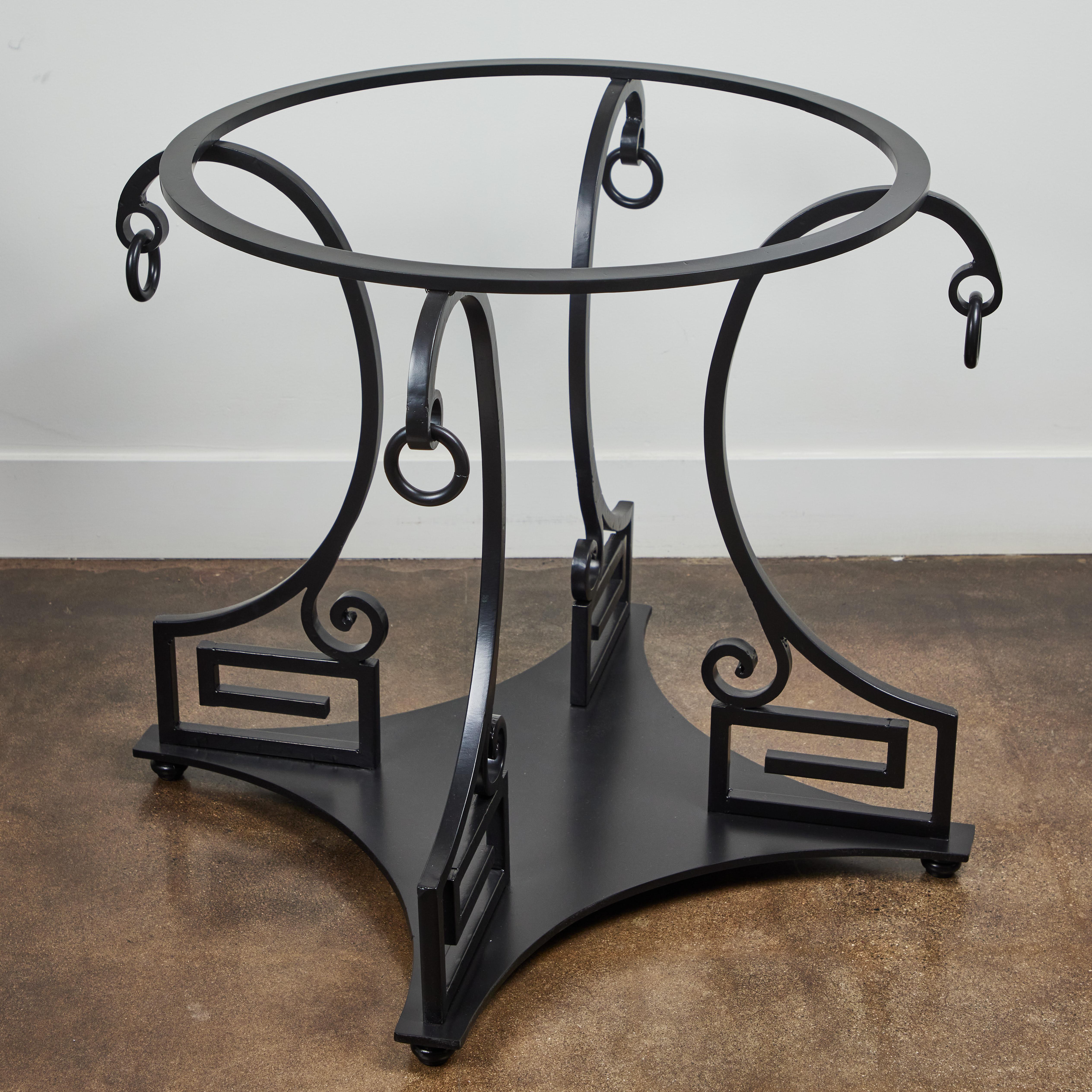 Timeless classicism, a beautiful Neoclassic style, Greek key table of wrought iron, early 20th century. The table could be used as either a center table or smaller scale dining table.