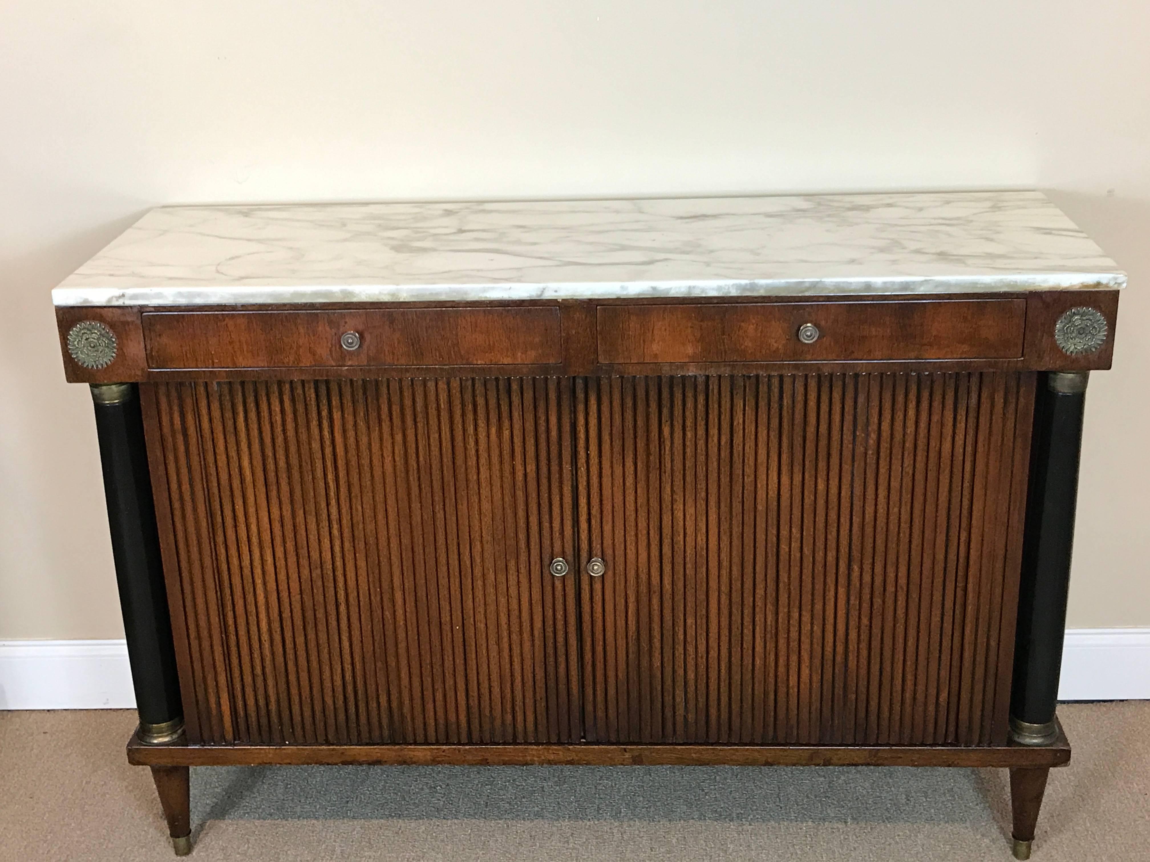 Neoclassic marble-top tambour cabinet, in the style of Maison Jansen
Fitted with two 21.5