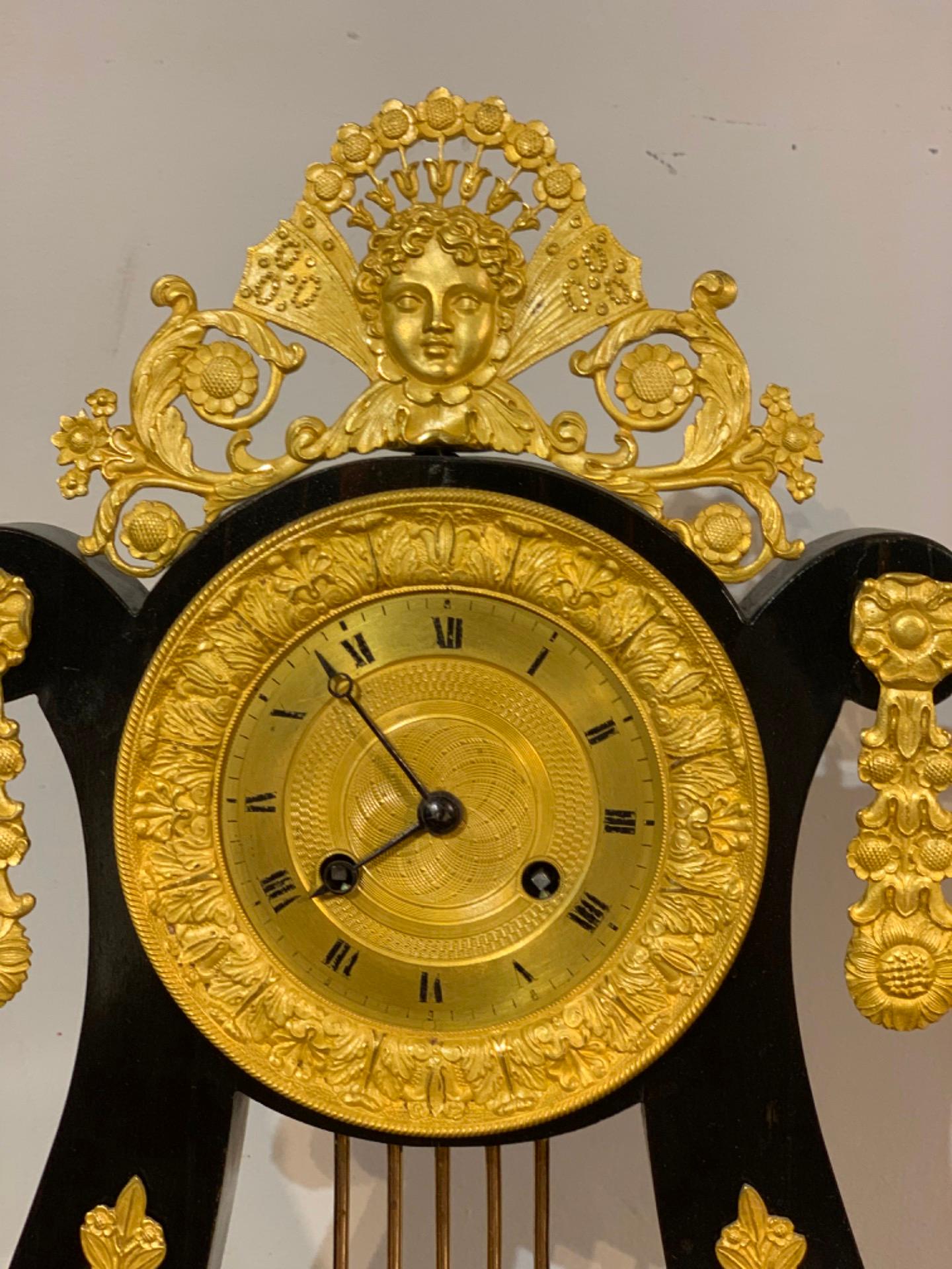18th Century Neoclassic Parisian Pendulum Clock in Bronze and Ebonized Wood For Sale