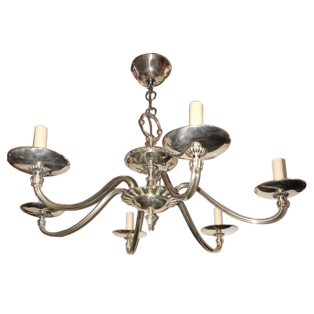 A circa 1920s English silver plated 6-light chandelier.

Measurements:
Height of body: 13