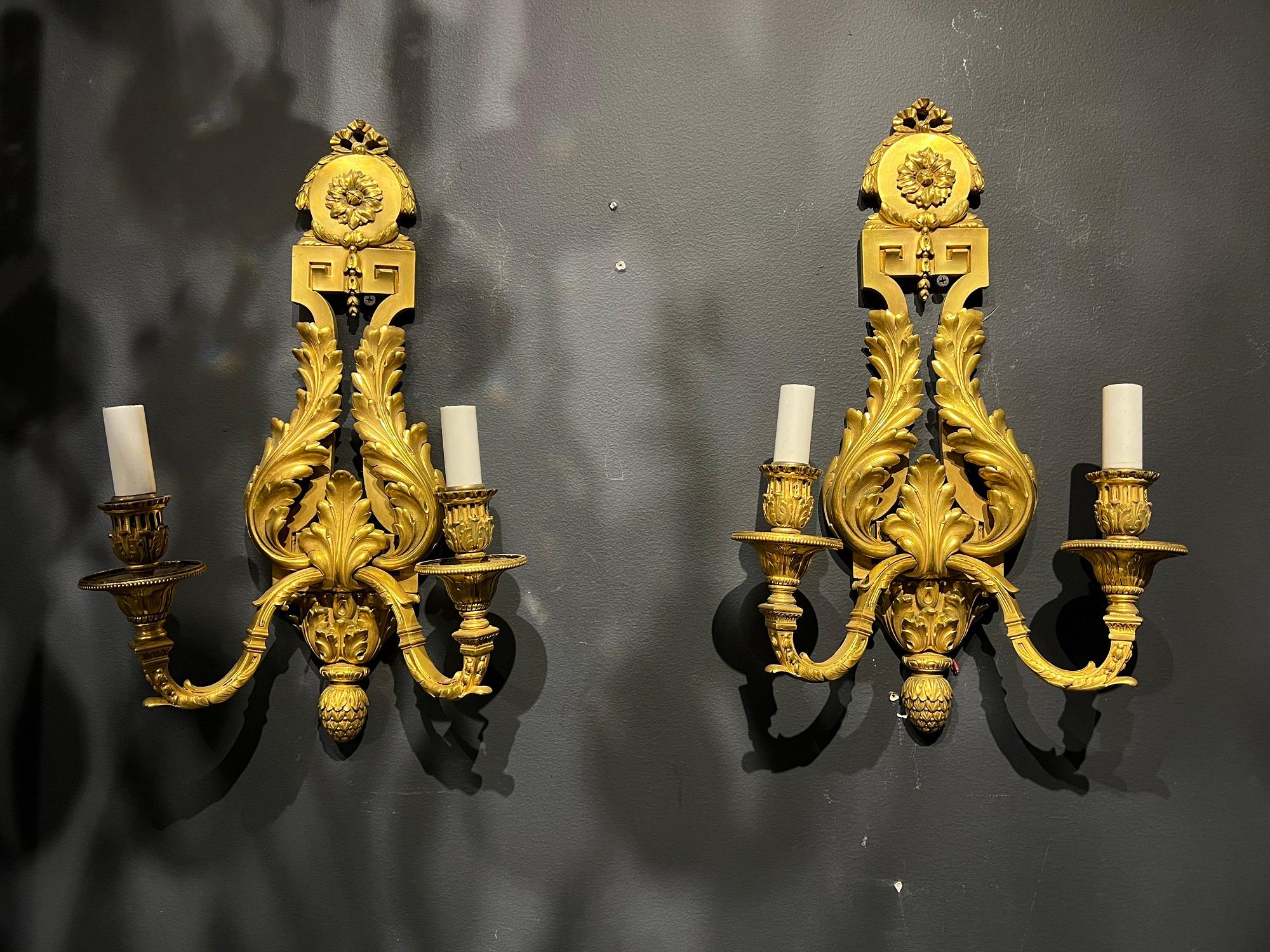 A pair of circa 1900’s gilt bronze Neoclassic design Caldwell sconces with original gold finish. In very good vintage condition. 

Dealer: G302YP 