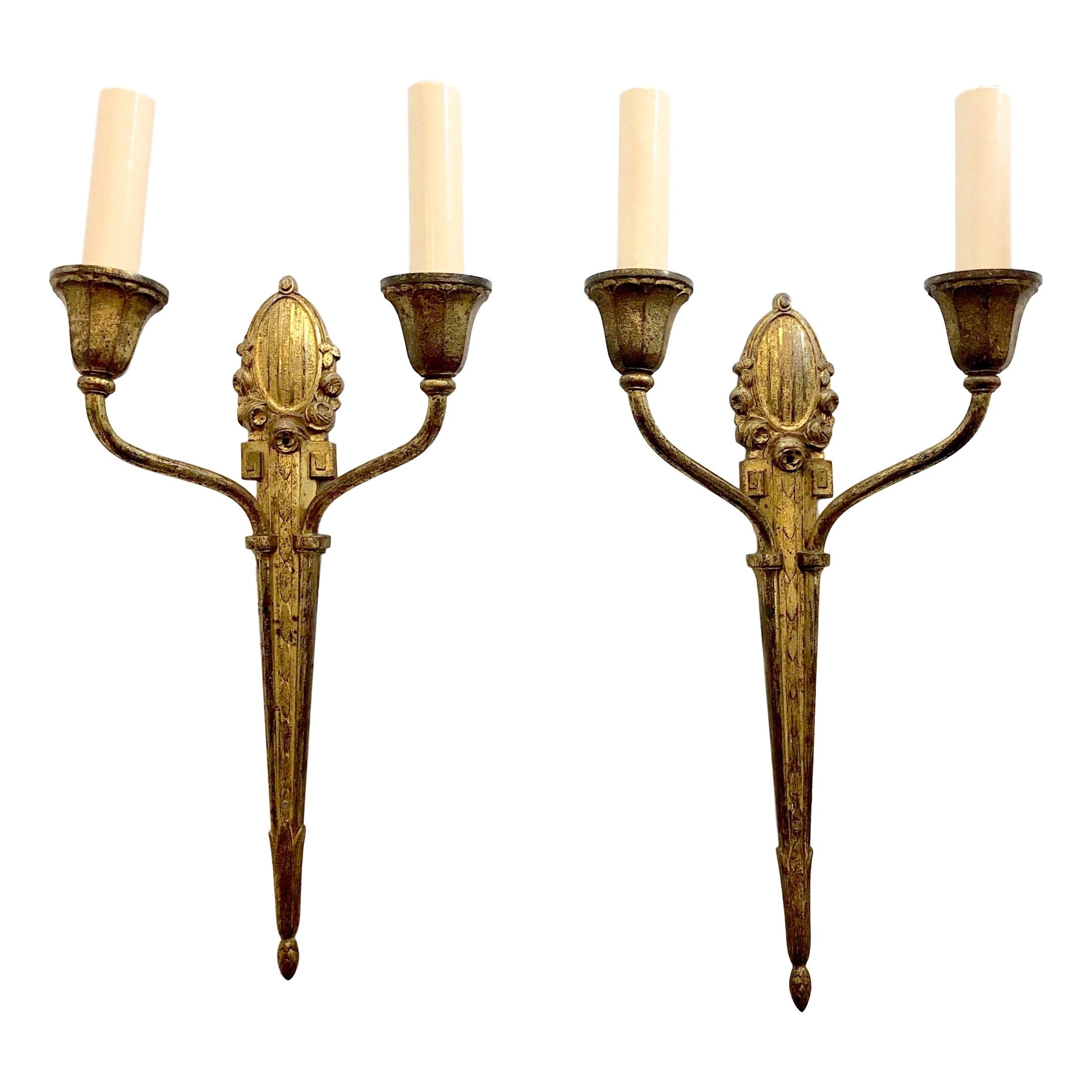 Pair of circa 1910 French gilt bronze sconces with 2 lights.

Measurements:
Height: 16