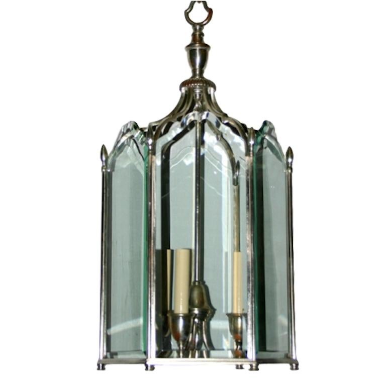 A circa 1920's silver plated neoclassic style lantern with etched glass panels and four interior lights. Original finish and patina.

Measurements:
Height 31