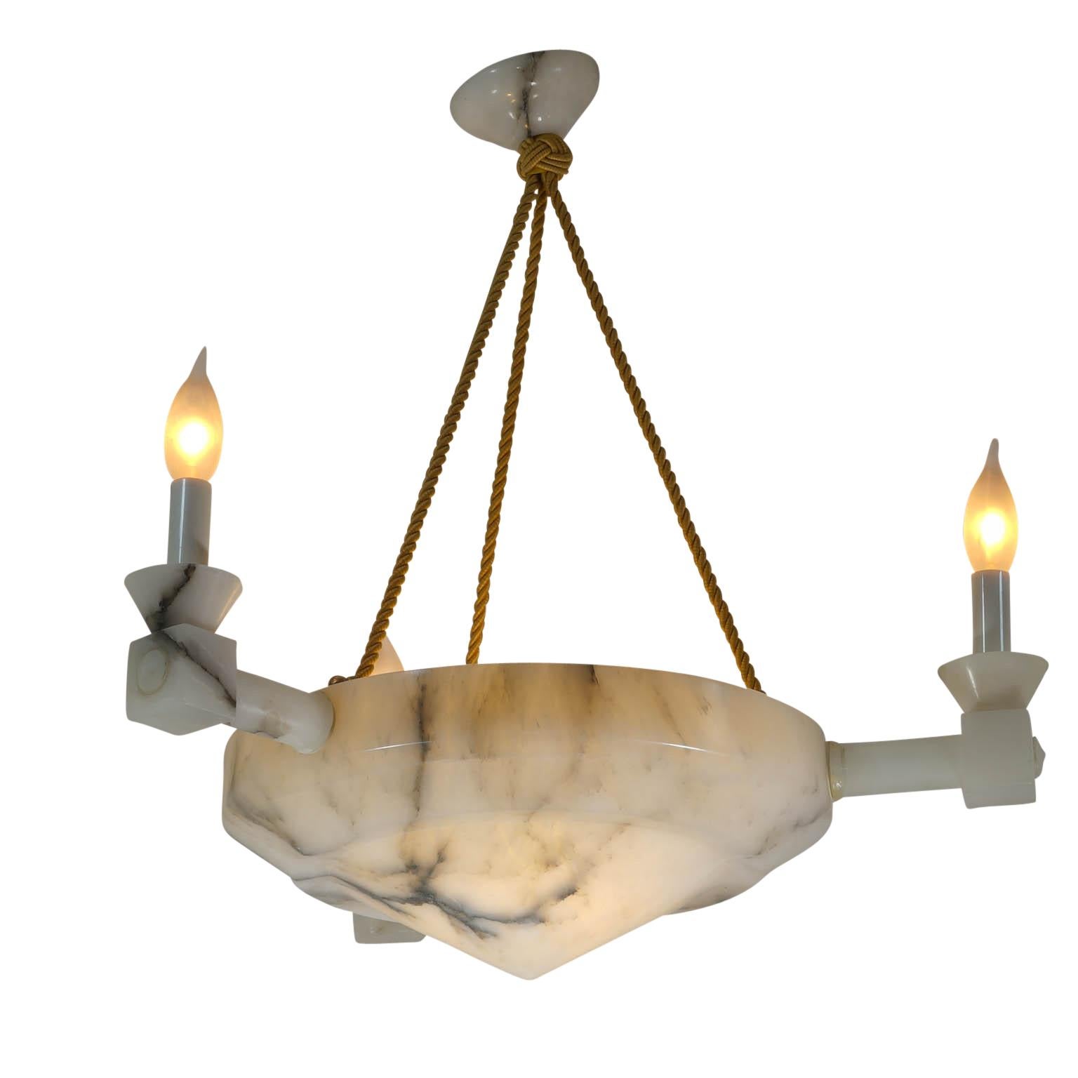 A central shade with an interior bulb is softly illuminated as the focus of the design, while three arms stretch lighting into the room. Rewired and impeccably polished.