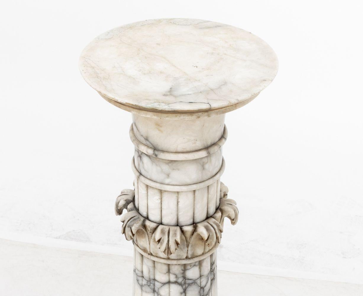 Neoclassical Alabaster Pedestal, with acanthus motifs, circular top and octagonal base. 39.5