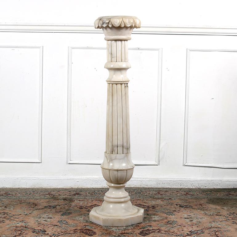 Stunning Alabaster pedestal neoclassical urn lamp. Amazing aged patina, it provides a charming light and has an stunning appearance when lit. The pedestal and the urn can be placed together or displayed separately. This elegant carved alabaster urn