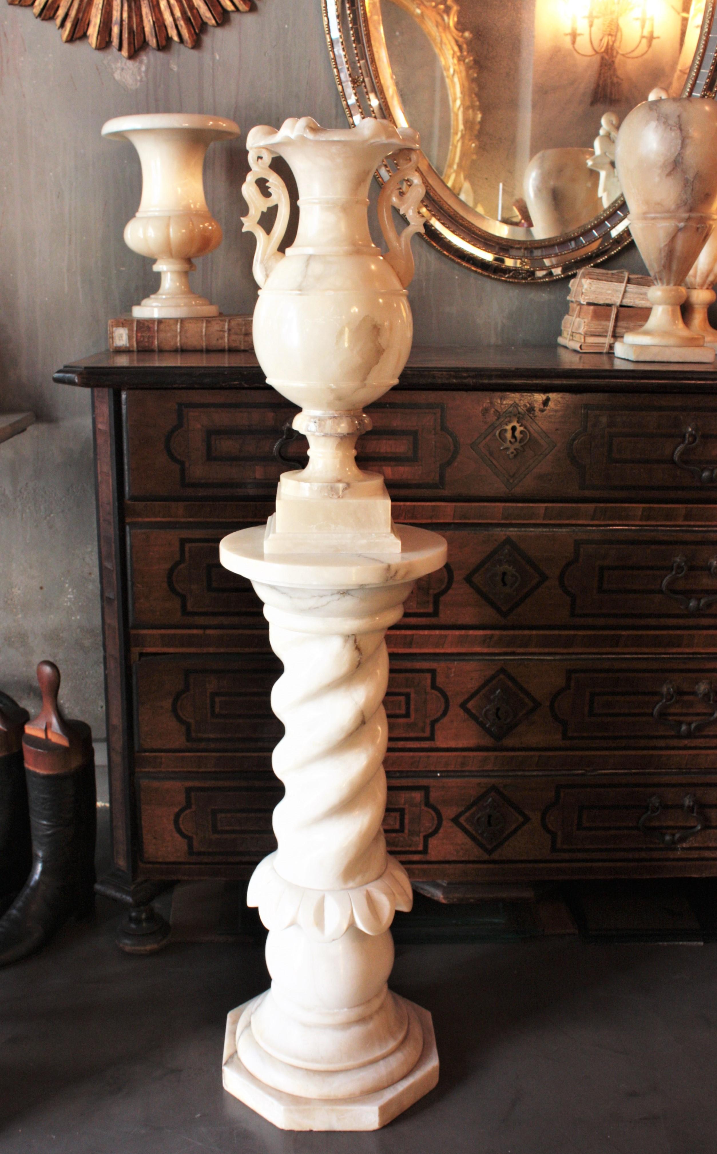 Carved Alabaster Floor Lamp.
Outstanding Neoclassical carved alabaster urn lamp with handles on column pedestal stand, Spain, 1930s-1940s
This alabaster floor lamp has an elegant neoclassical design. The Urn urplighter lamp stands has beautiful