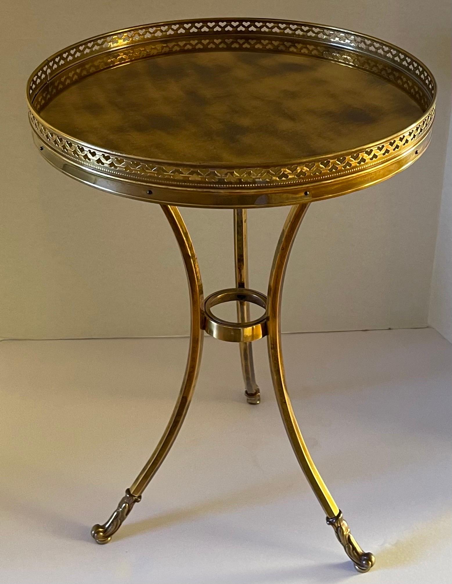 1960s tripod leg round top gueridon table. Pierced brass decorative rail around the table top. As found antique burnished brass construction.