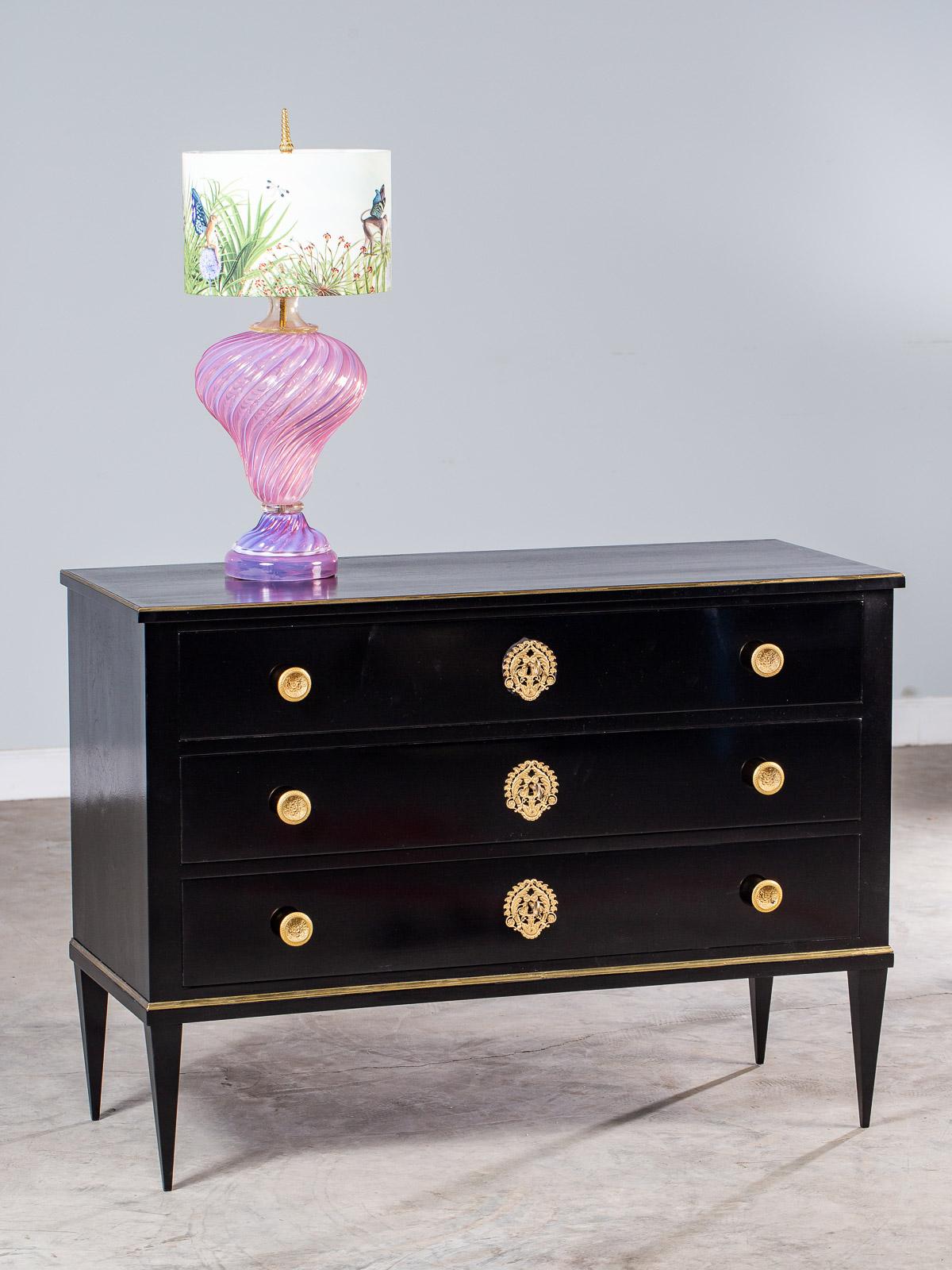 A striking antique Italian Empire ebonized neoclassical chest of drawers, circa 1820. The superb modern lines of this antique Italian chest remain as potent today as when they were first seen at the beginning of the nineteenth century. Rectangular