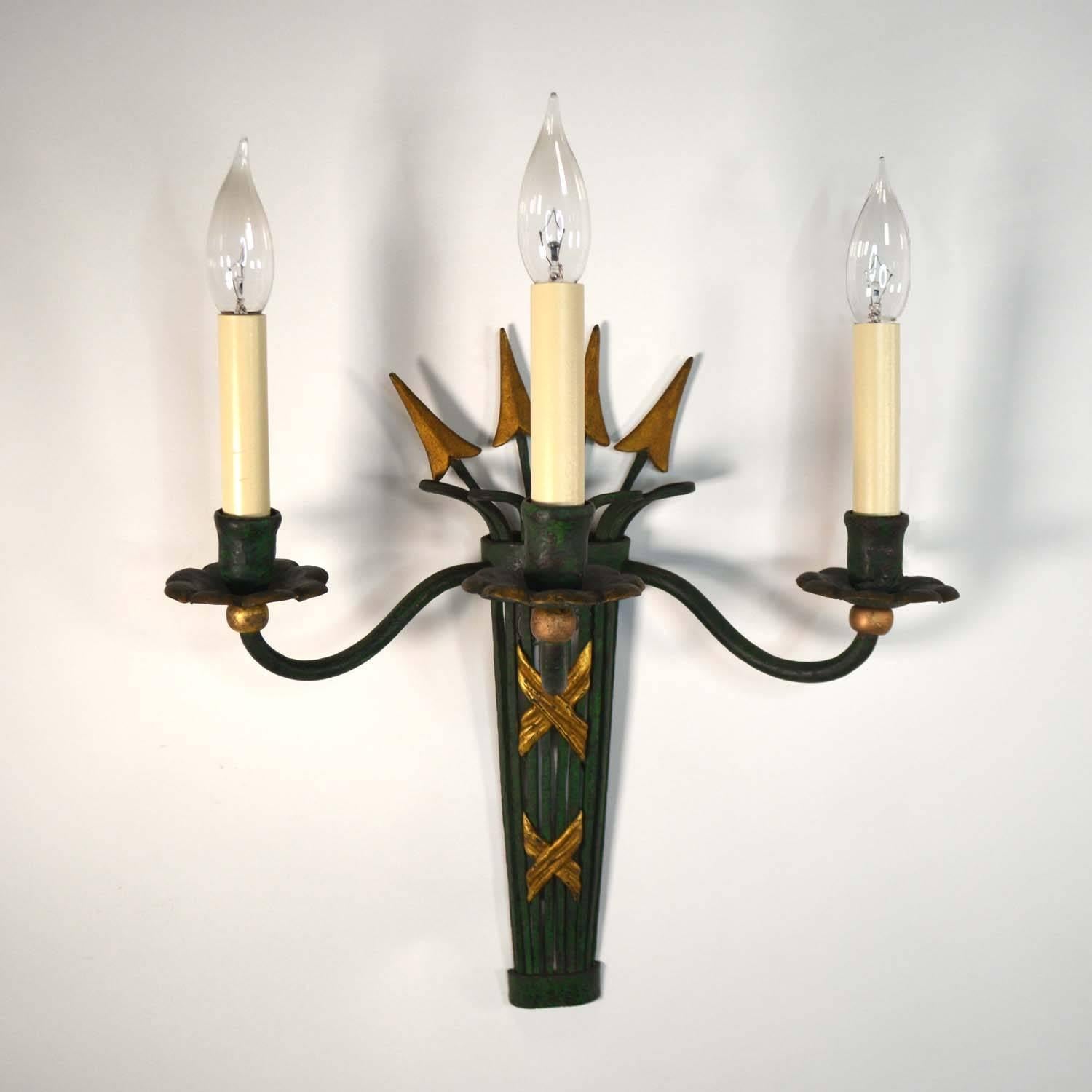 A pair of Hollywood Regency painted metal three light sconces in the form of a quiver holding arrows with gold ends. Most likely French, 1940s or 1950s.