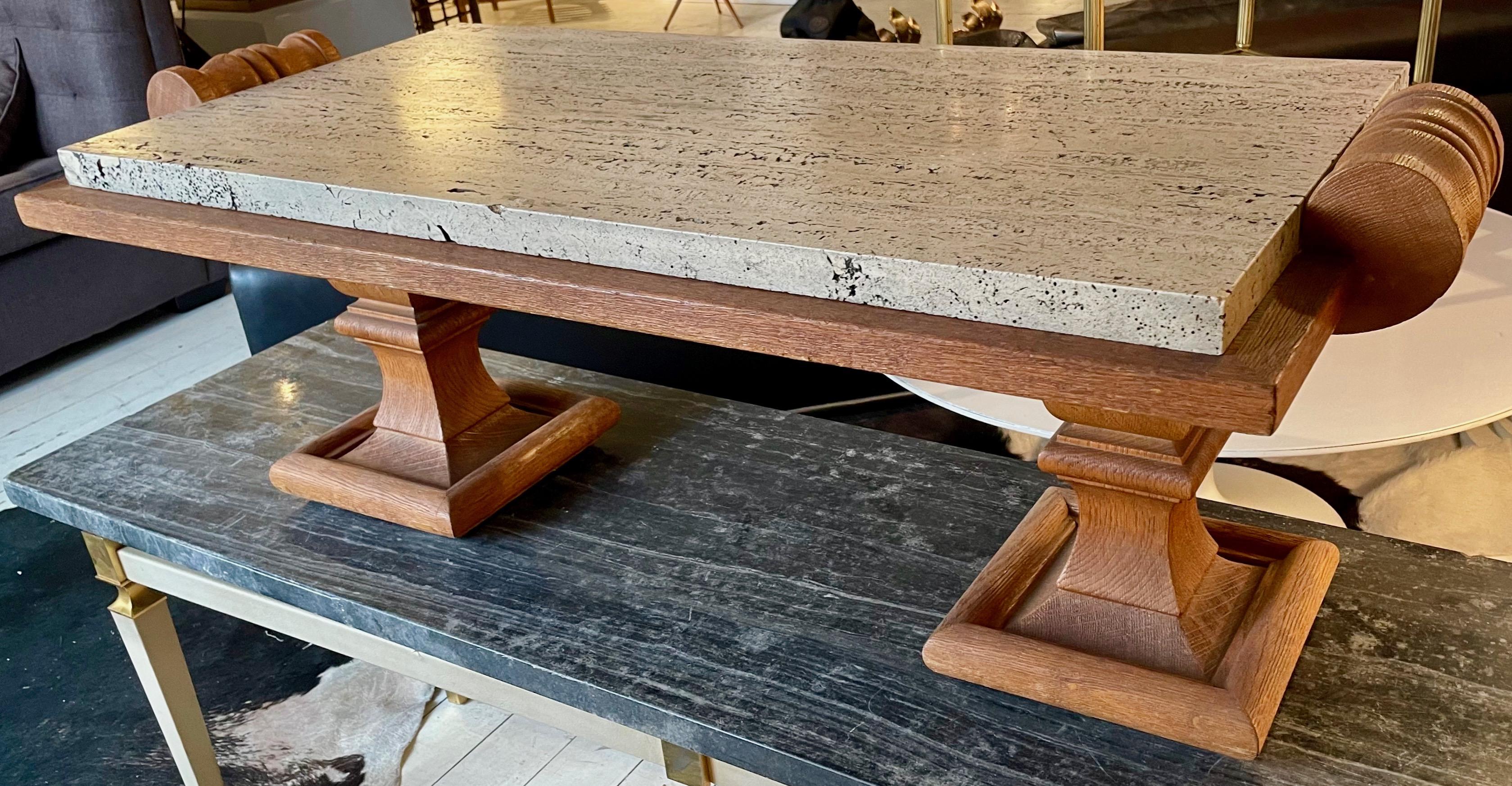 Massive and veneer sanded oak neoclassical table with a thick travertine top.
Litt: a very close model illustrated in 