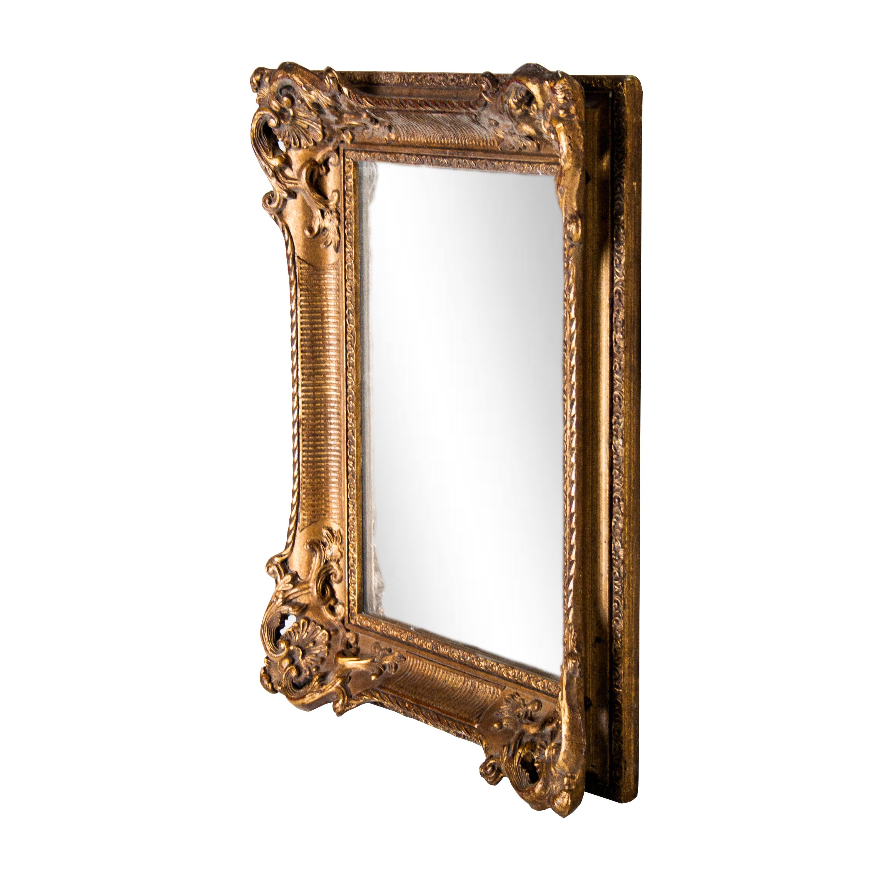Neoclassical baroque style handcrafted mirror. Hand carved wooden structure with gold foil finished, Spain, 1970.