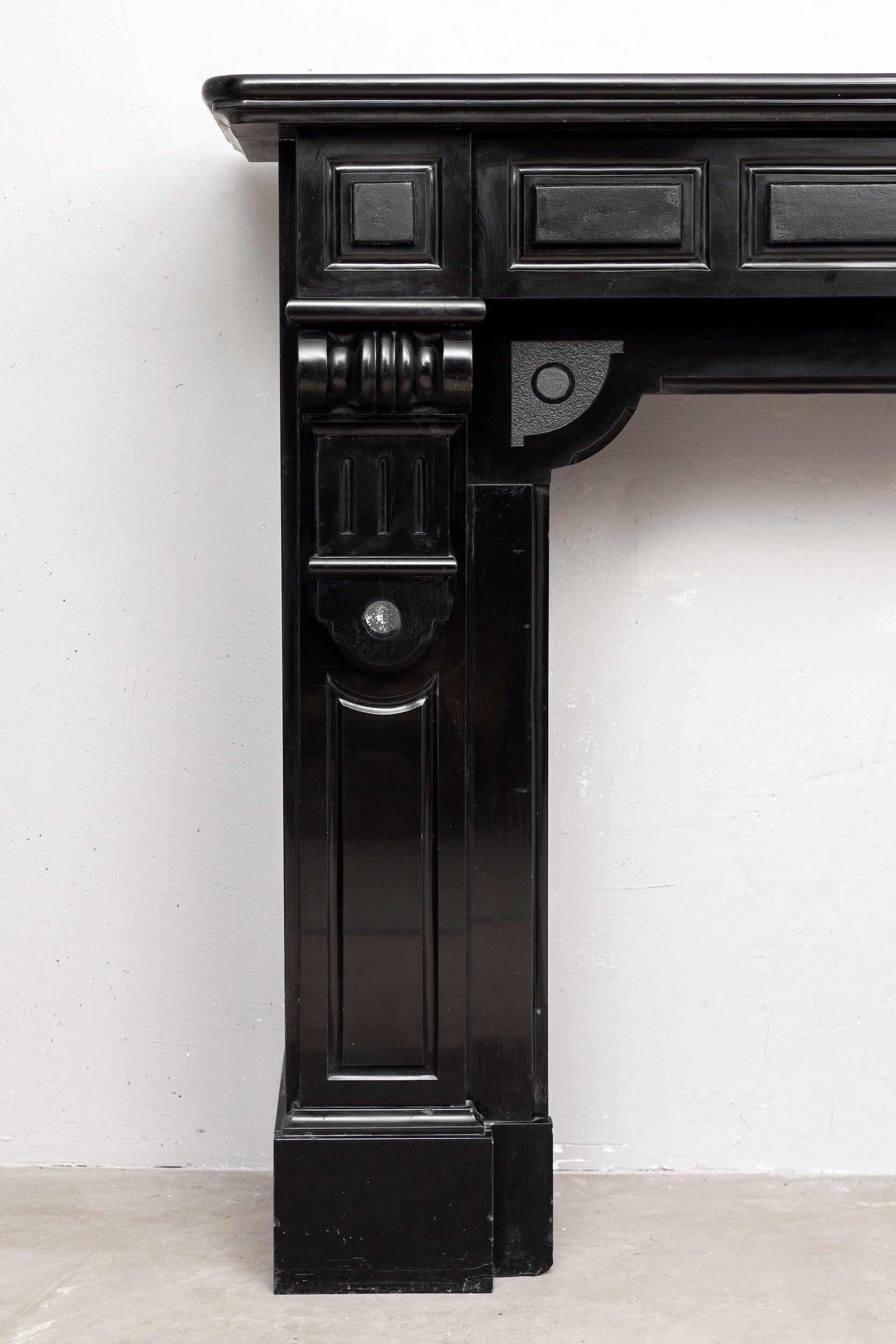 Beautiful antique marble fireplace made of Noir de Mazy marble. The stateliness radiates from this wonderful fireplace in neoclassical style. The mantelpiece has been carefully dismantled from the Statenkwartier in The Hague. The origin, therefore,