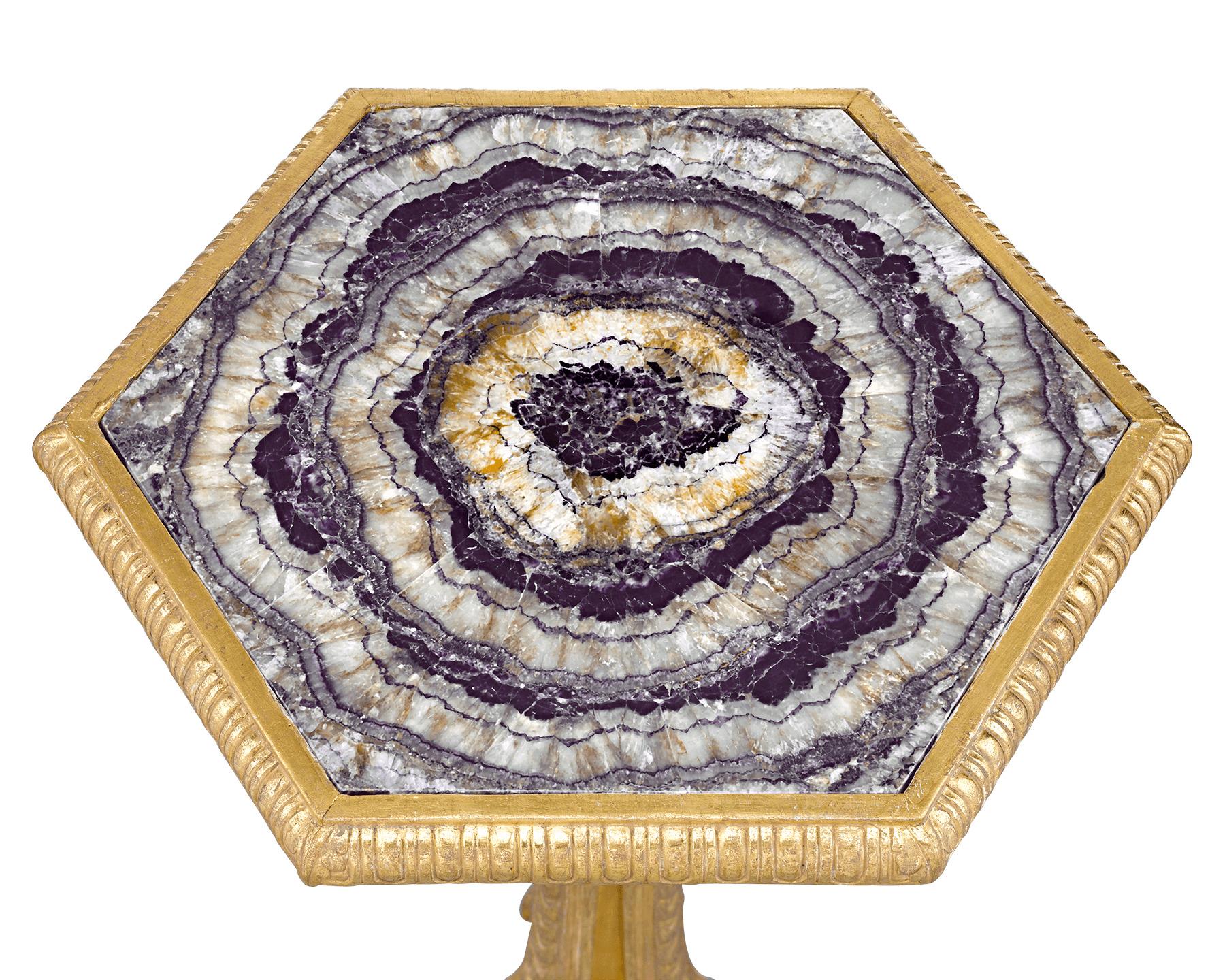 An impressive example of rare Blue John is inset into the surface of this neoclassical giltwood table. The hardstone possesses all the best qualities of this rare semiprecious mineral, from its radiating crystalline structure to its vivid shades of