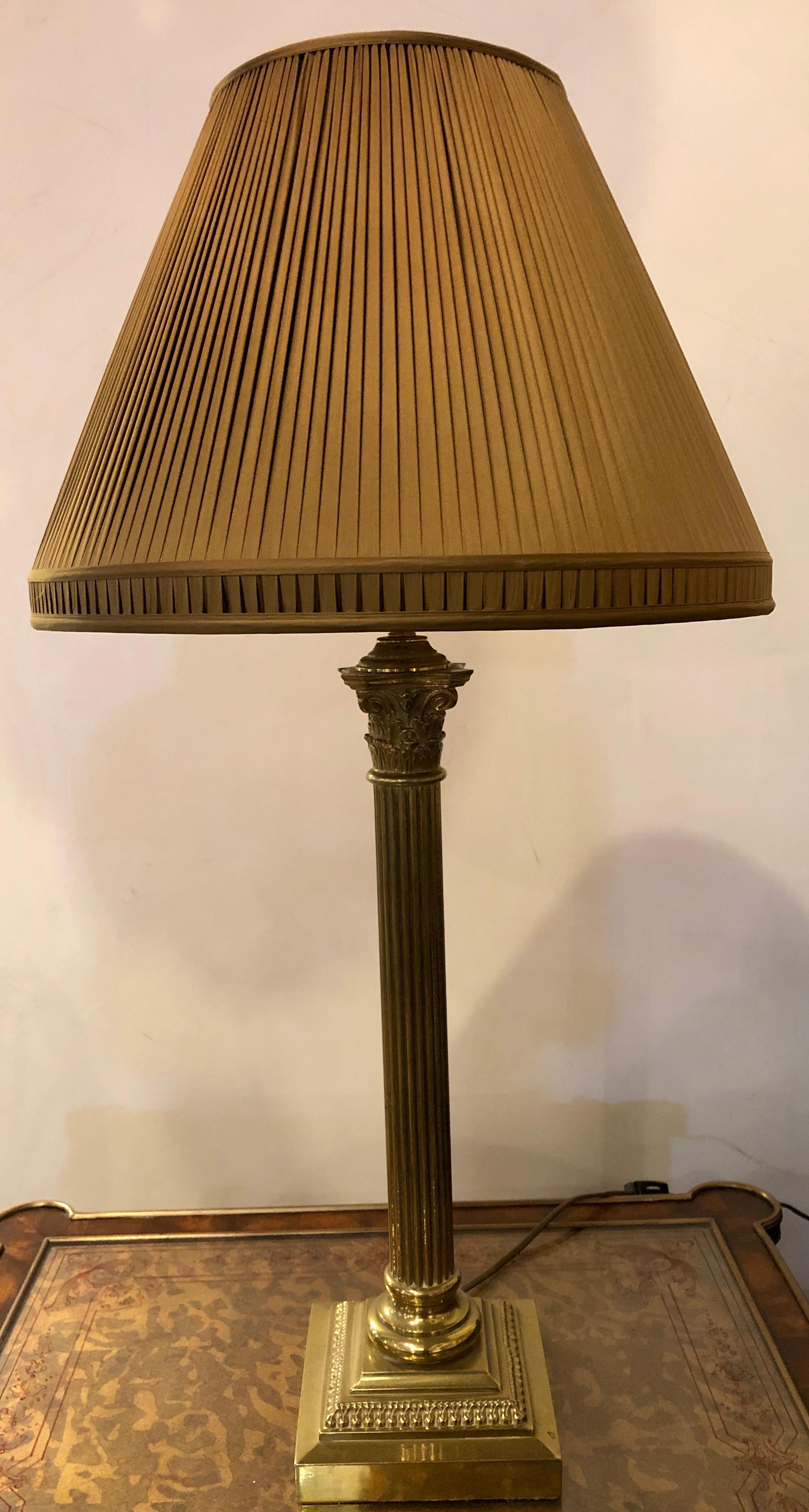 Neoclassical brass column form table lamp with custom shade.
 