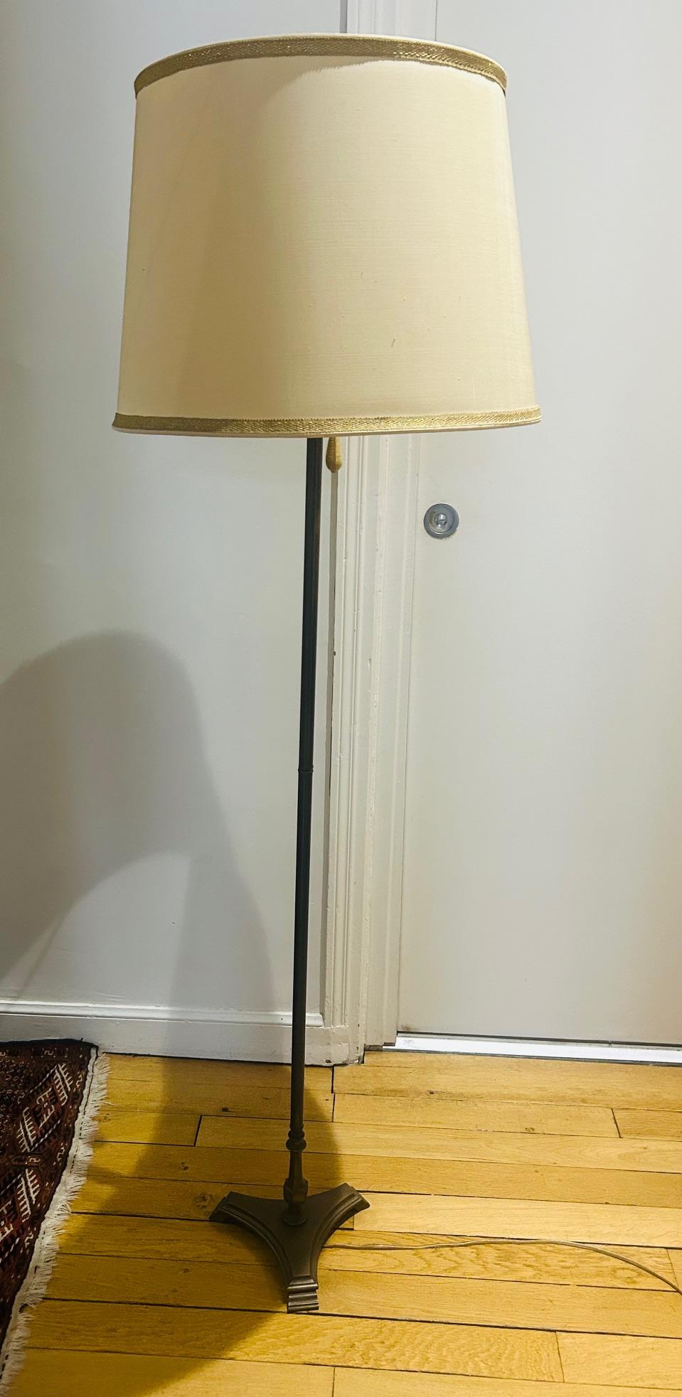 floor lamp from the 1950's in solid brass with two independent lights and its orignal shade 