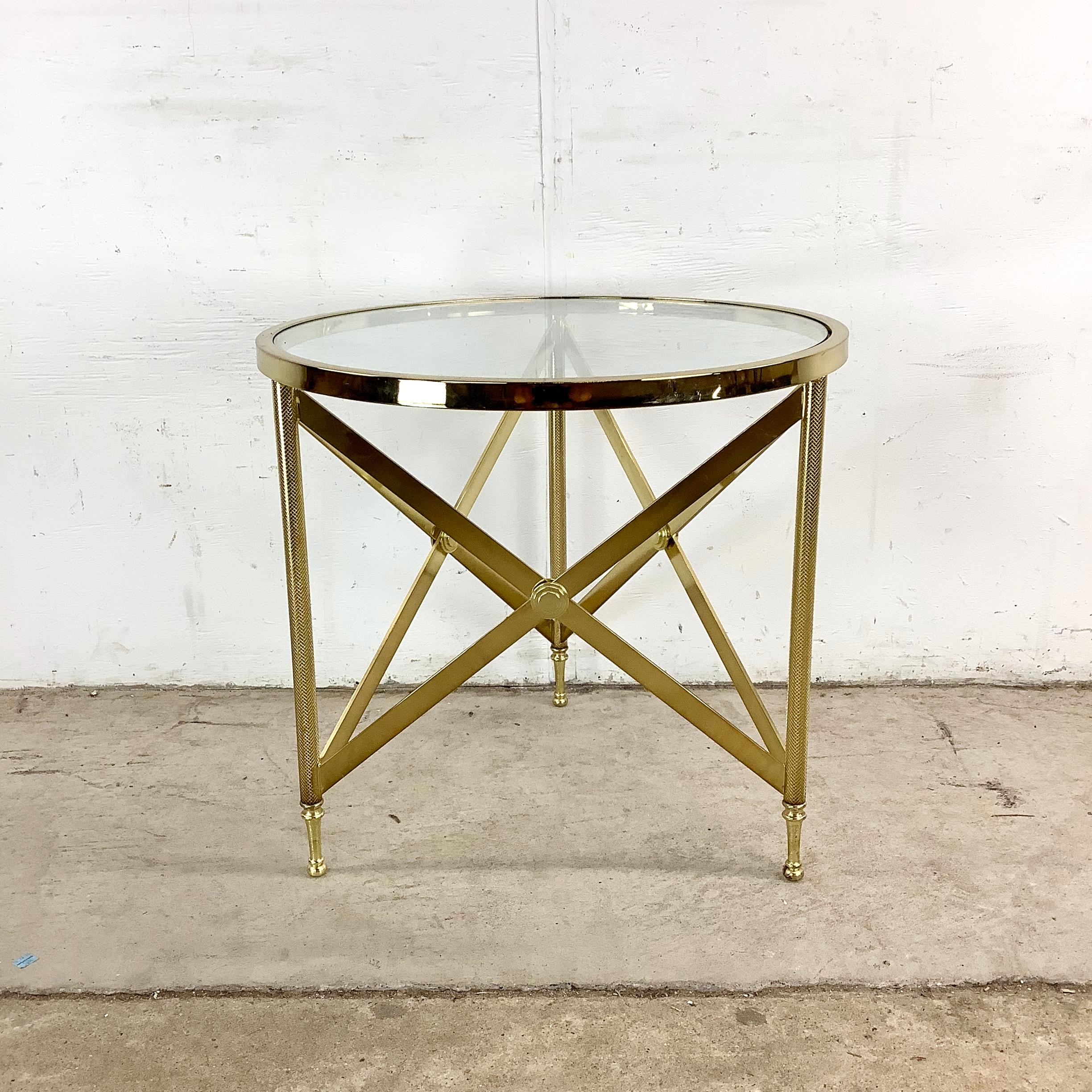 A refined exemplar of 20th-century decorative arts, this vintage brass side table evokes the timeless elegance of Maison Jansen’s neoclassical-inspired oeuvre. The composition pairs classical proportions with a modern sensibility, echoing the