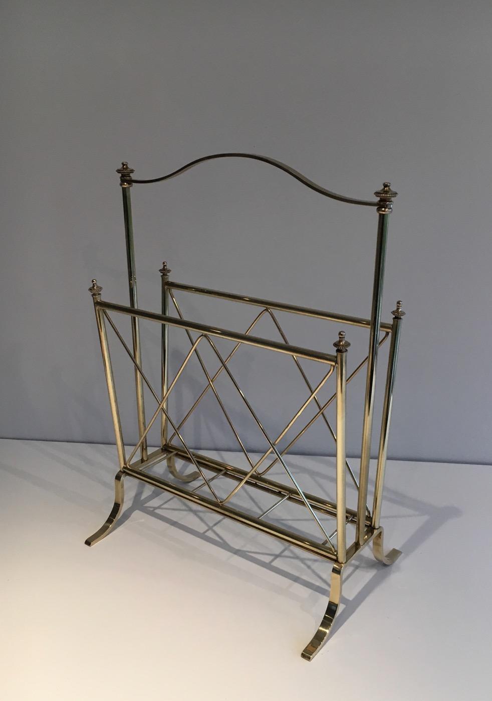 This very nice and elegant neoclassical stye magazine rack is all made of brass. This is a French work attributed to famous French designer Maison Jansen. Circa 1940.