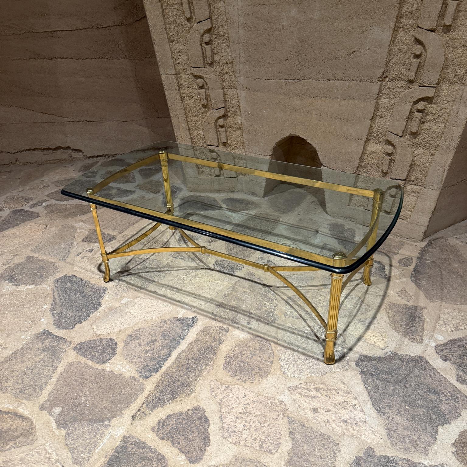 For your consideration, a neoclassical brass plated coffee table. Unmarked, attributed to La Barge. Original glass with beveled edges.
 
Dimensions: 54 W x 23.75 D , 16.75 H

Delivery within 200 miles from San Diego CA is available for an additional