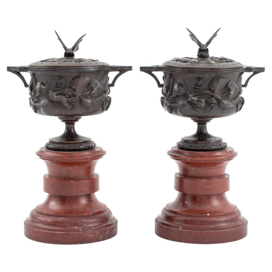 Neoclassical Bronze Covered Urns on Marble, Pair For Sale