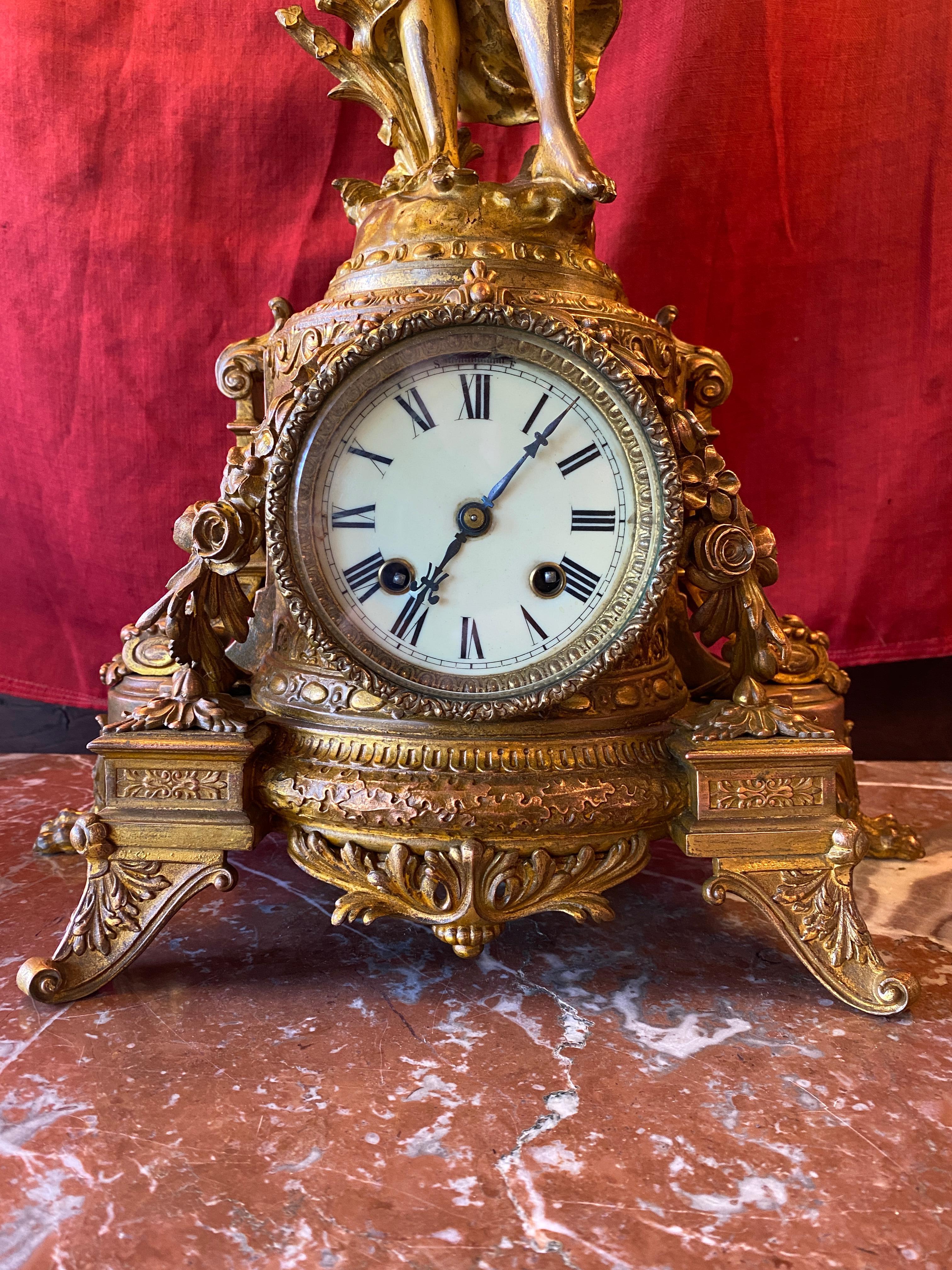 NeoClassical revival bronze Mantle clock circa 1950 NYC. Winged fairy statue rests above a neoclassical footed clock. Asonia Clock Co. NYC Circa 1900
No key, non-operational this item is being sold as decorative art.