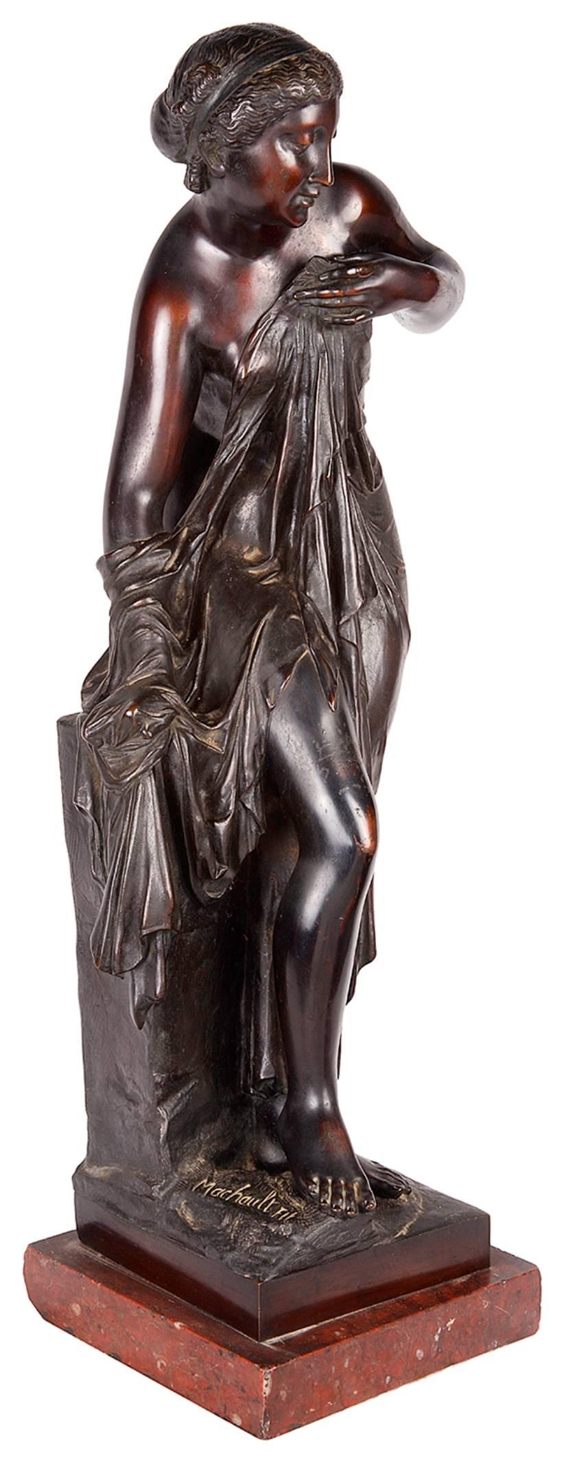 A good quality 19th century bronze statue of a neoclassical semi clad female resting against a plinth and raised on a Rouge marble base.
Signed; Machault.