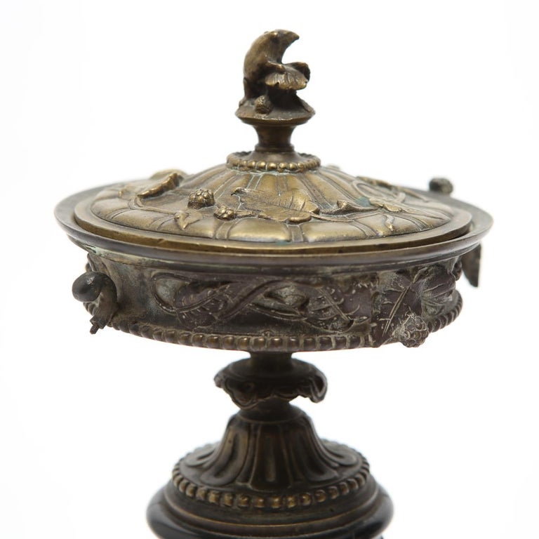 Neoclassical Bronze Tazza Urns with Lids on Black Marble Plinths at 1stDibs