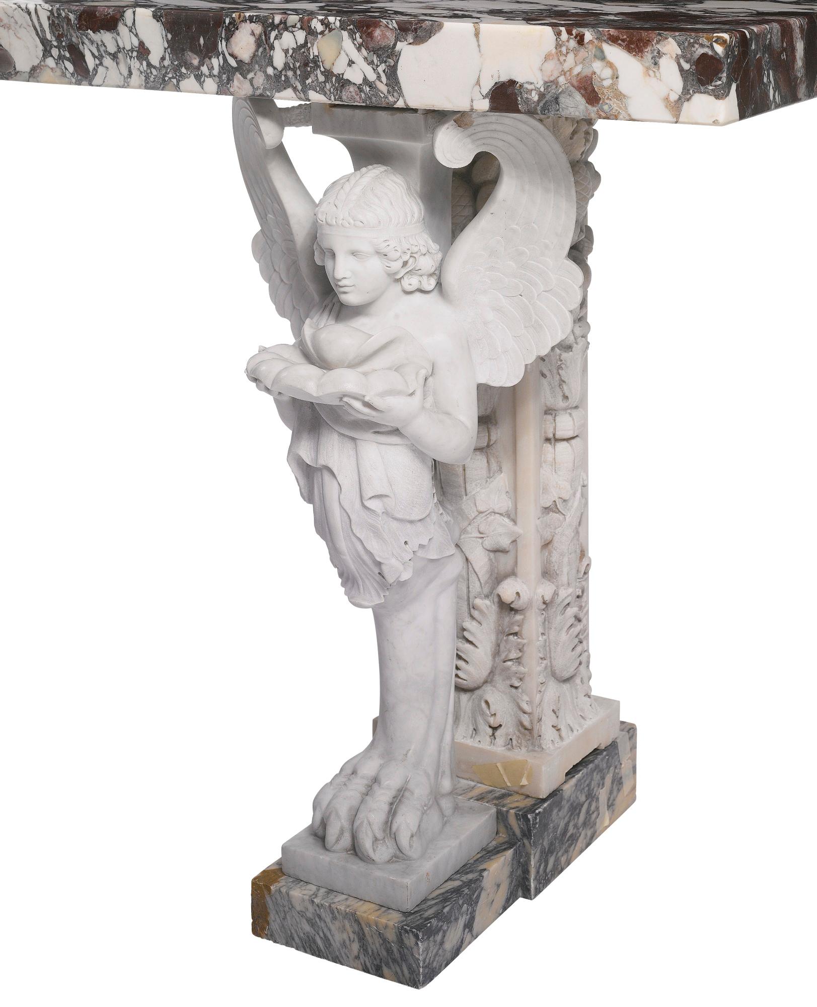 A large carved marble and breche violette topped console table. Free standing with winged figural supports holding a shell and beautiful marble top.

Provenance: Sotheby's Private Collections Sale, April 2015.