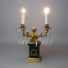 Neoclassical Cherub Figural Two-Arm Brass & Ebonized Metal Table Lamp 20thC