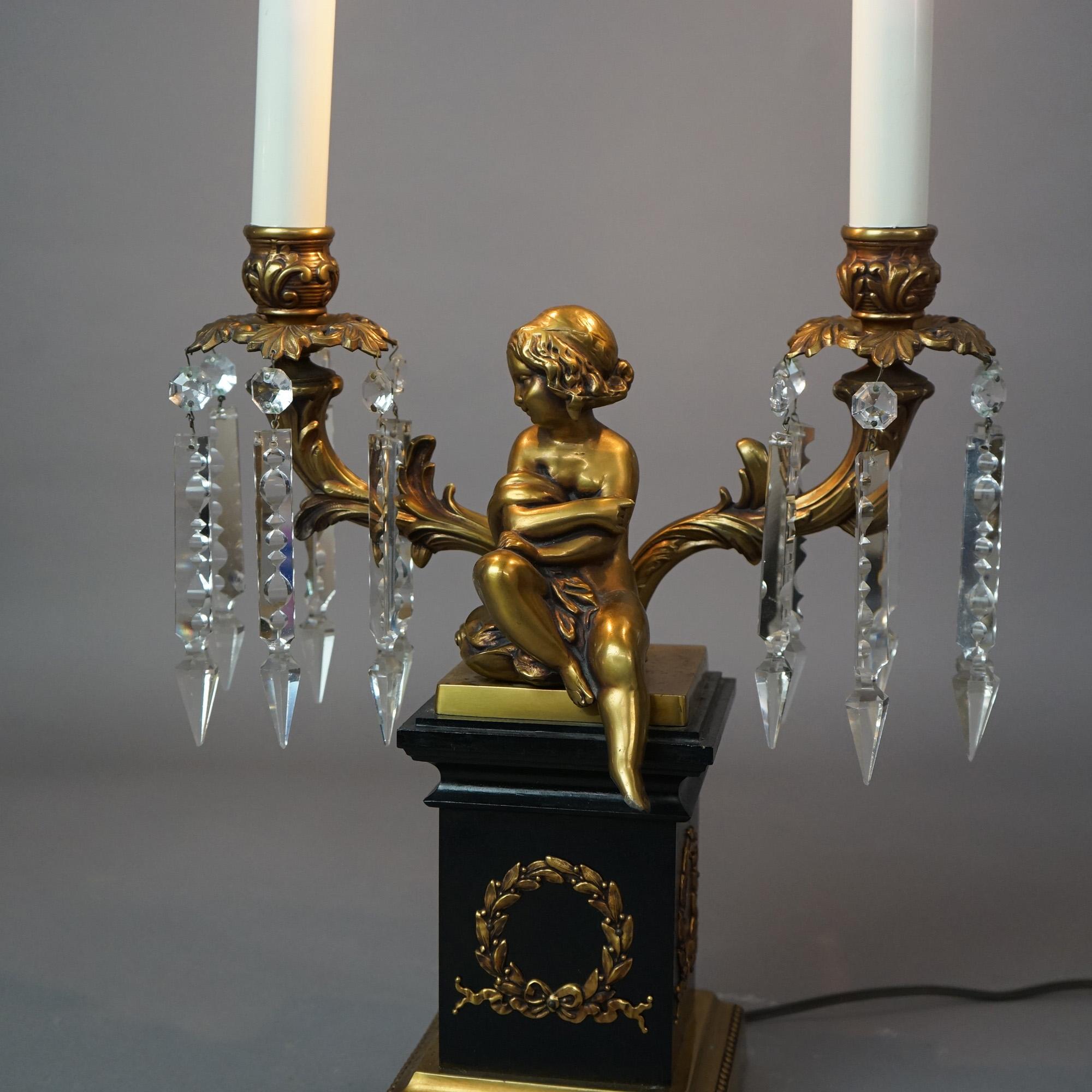 American  Neoclassical Cherub Figural Two-Arm Brass & Ebonized Metal Table Lamp 20thC For Sale