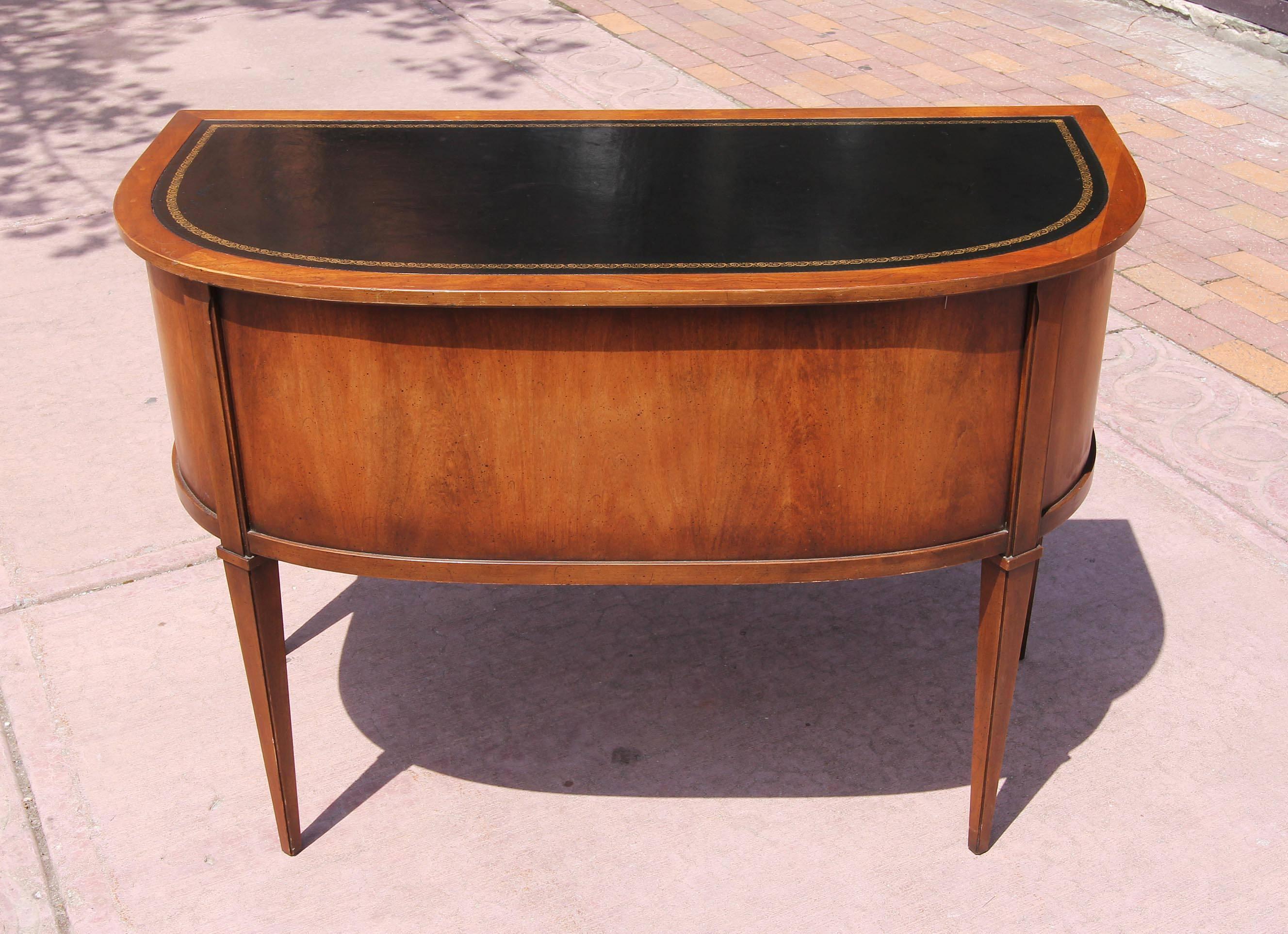 Vintage neoclassical desk with tooled leather top. Made by Sligh-Lowry. Pecan wood, circa 1960s.
