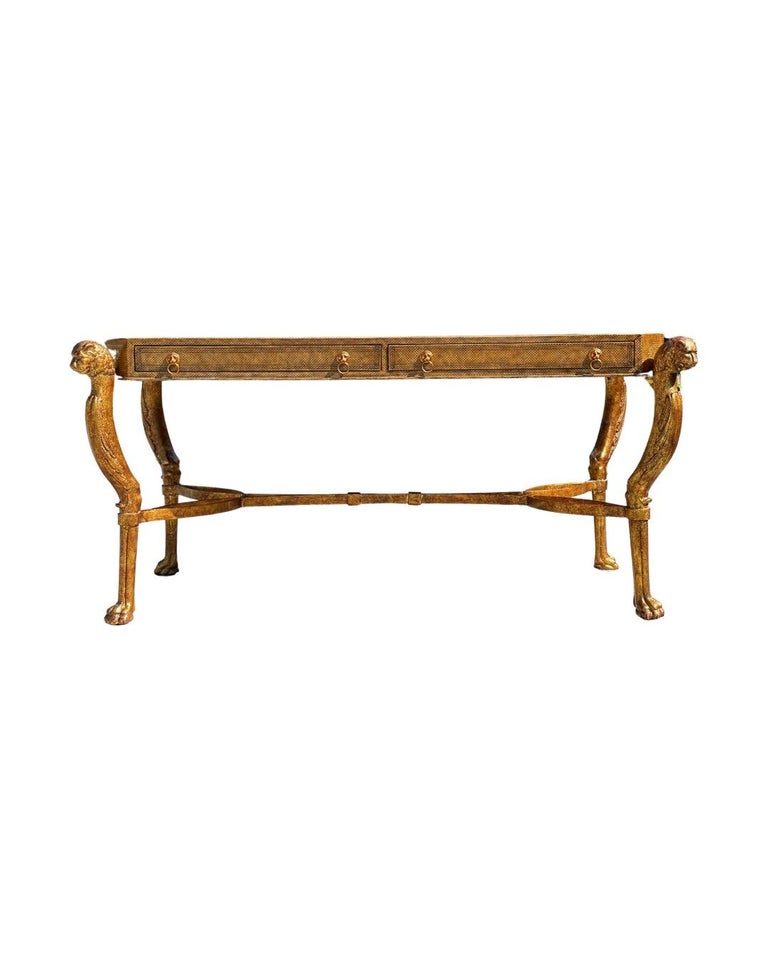 Fantastic neoclassical desk in leather and gilt wrought iron by Maitland - Smith. Leather has been treated and dyed to resemble ostrich leather. Solid gilt wrought iron base is rock solid. Each desk 