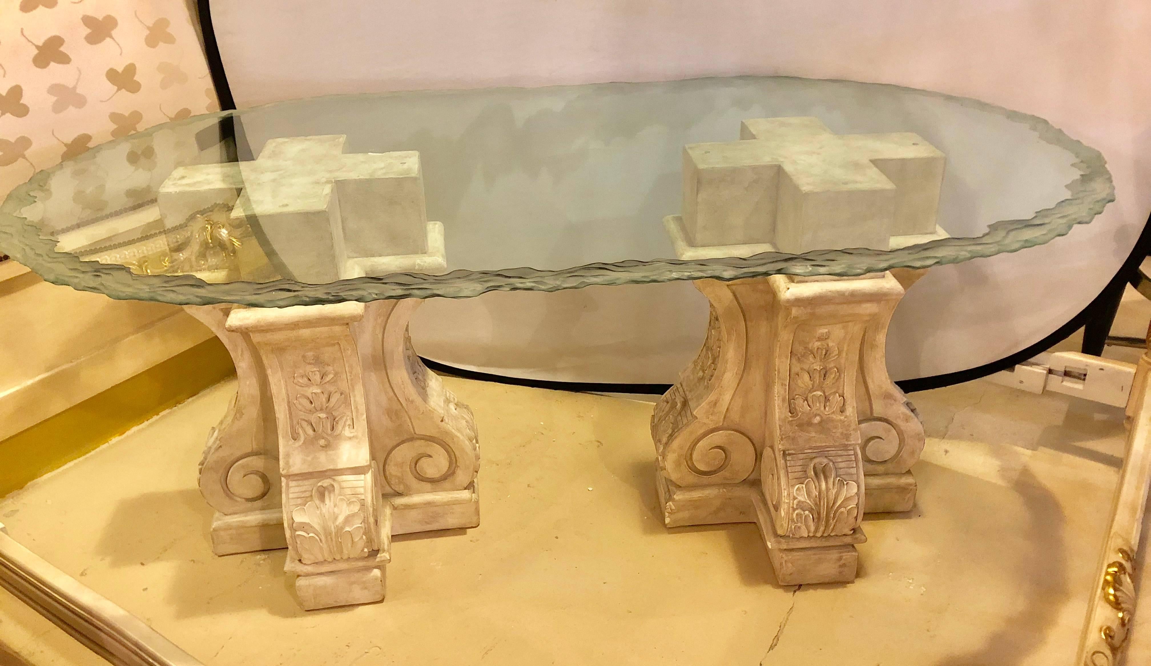 A neoclassical double column glass top Lalique style centre or dining table. A pair of finely detailed composite pedestals legs supporting a clear glass top of oval form with a Lalique style frosted edge. This wonderfully designed and decorated