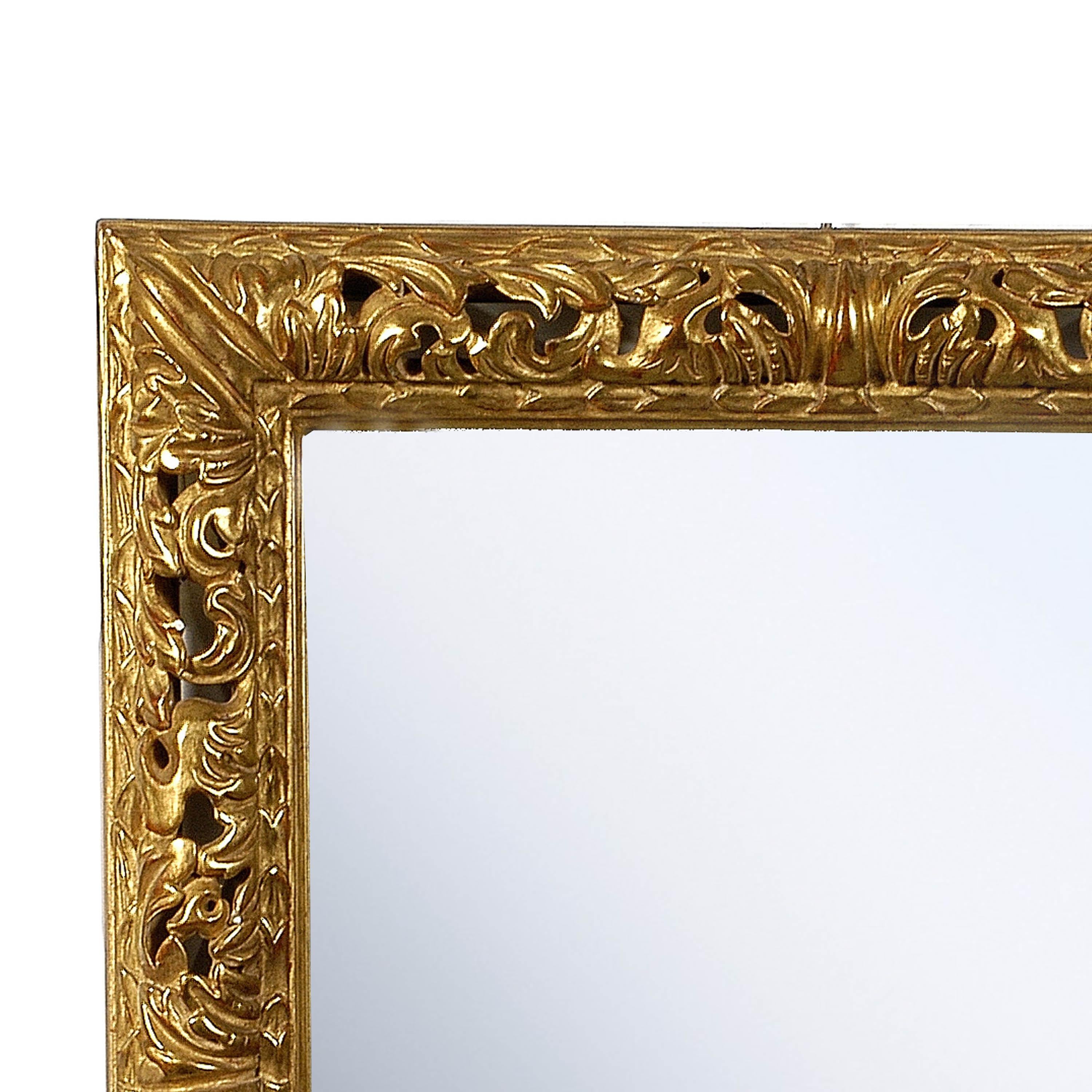 Neoclassical Empire rectangular handcrafted mirror. Rectangular hand carved wooden structure with gold foil finished, Spain, 1970.