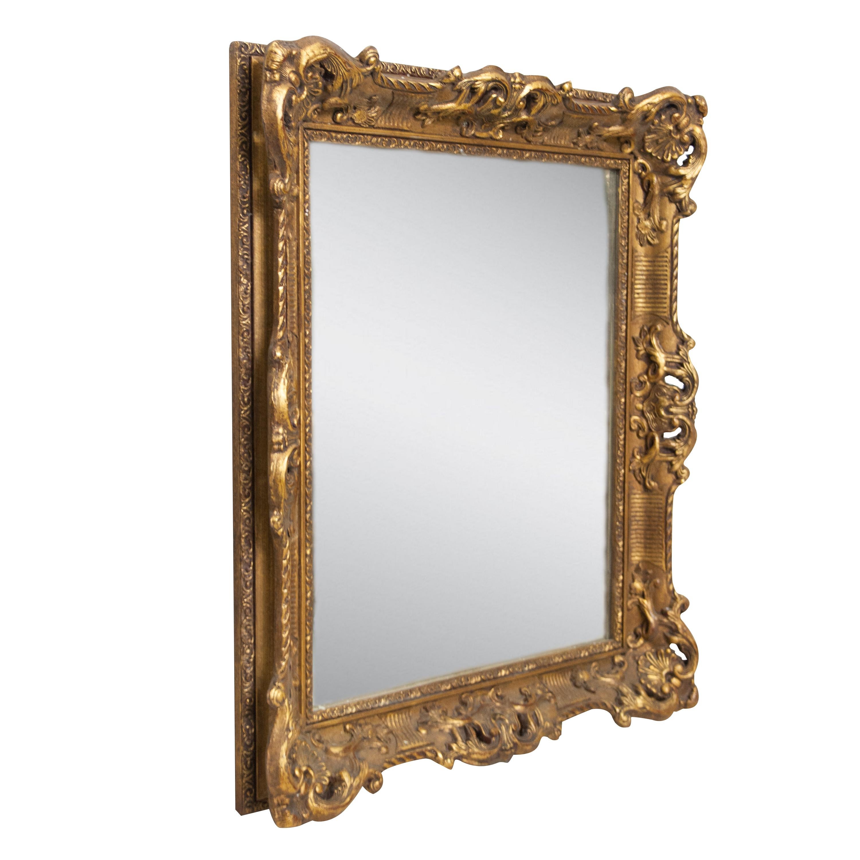 Neoclassical Empire rectangular handcrafted mirror. Rectangular hand carved wooden structure with gold foil finish, Spain, 1970.