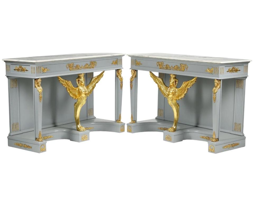 A gorgeous pair of Neoclassical or Empire style console tables featuring winged sphinx and Egyptian ormolu figures

USA, Circa Late 20th Century

Painted wood in a lovely gray color, with gilt wood center sphinx, classical and Egyptian ormolu