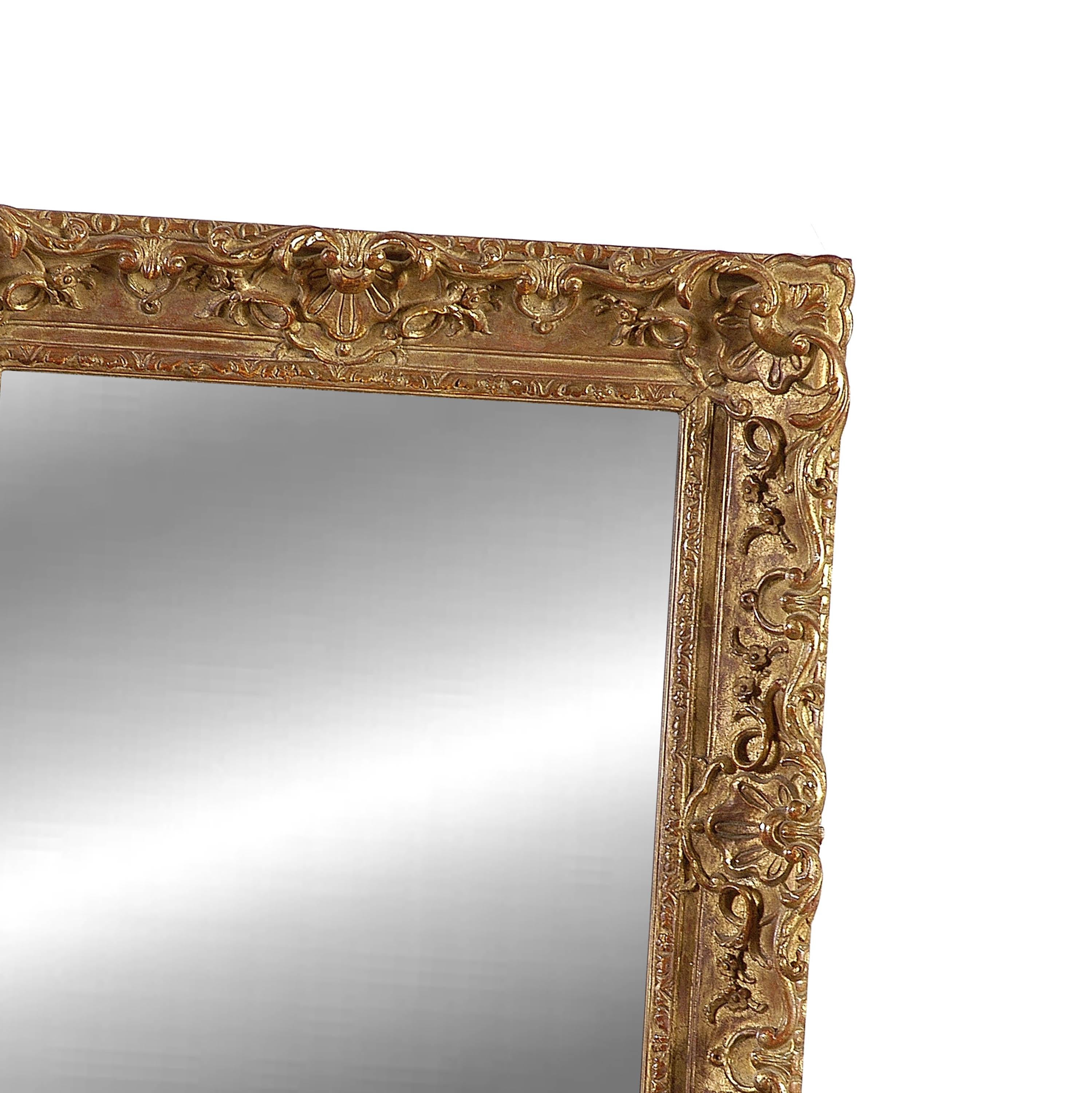 Neoclassical Empire rectangular handcrafted mirror. Rectangular hand carved wooden structure with gold foil finished. Spain, 1970.