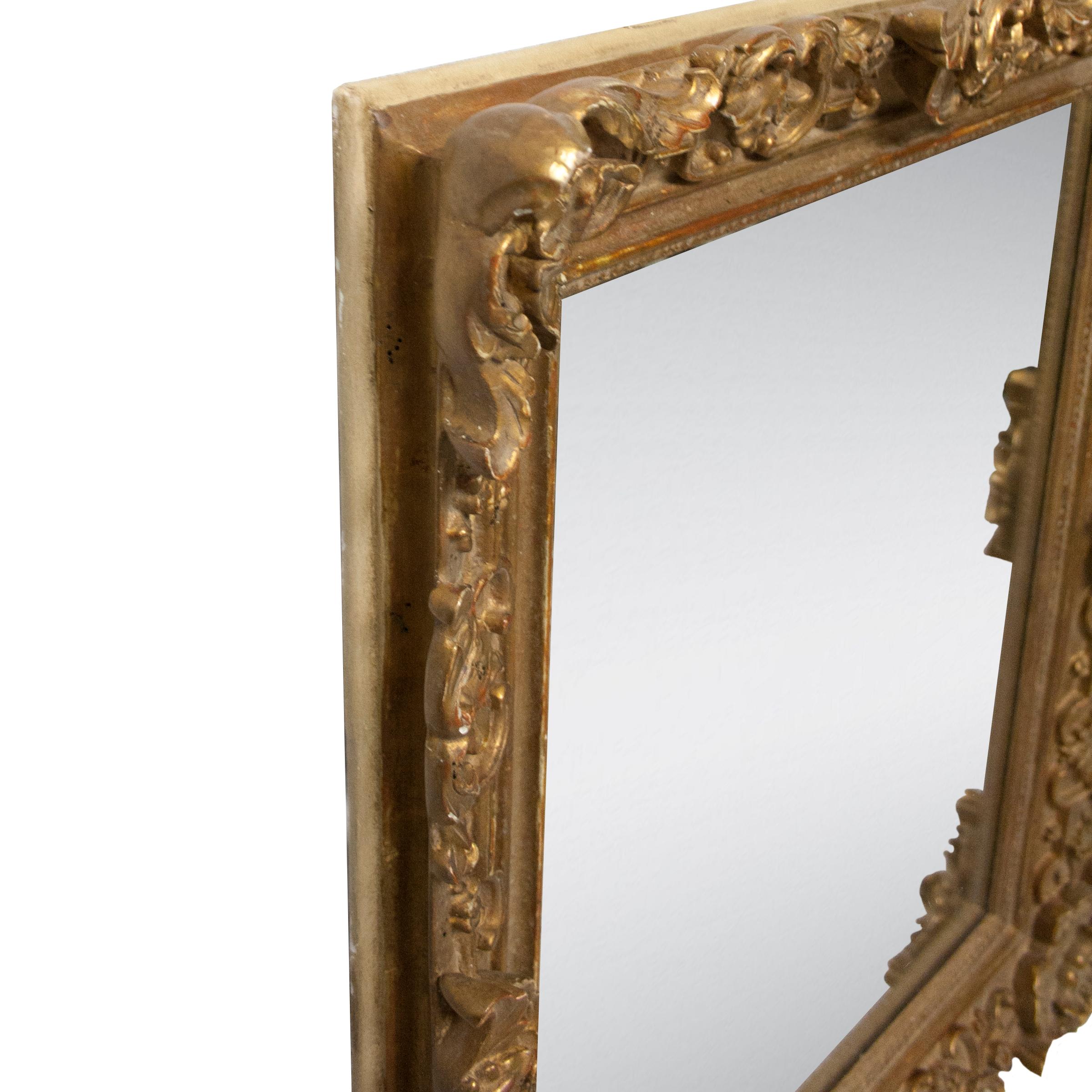 Neoclassical Empire rectangular handcrafted mirror. Rectangular hand carved wooden structure with gold foil finished, Spain, 1970.