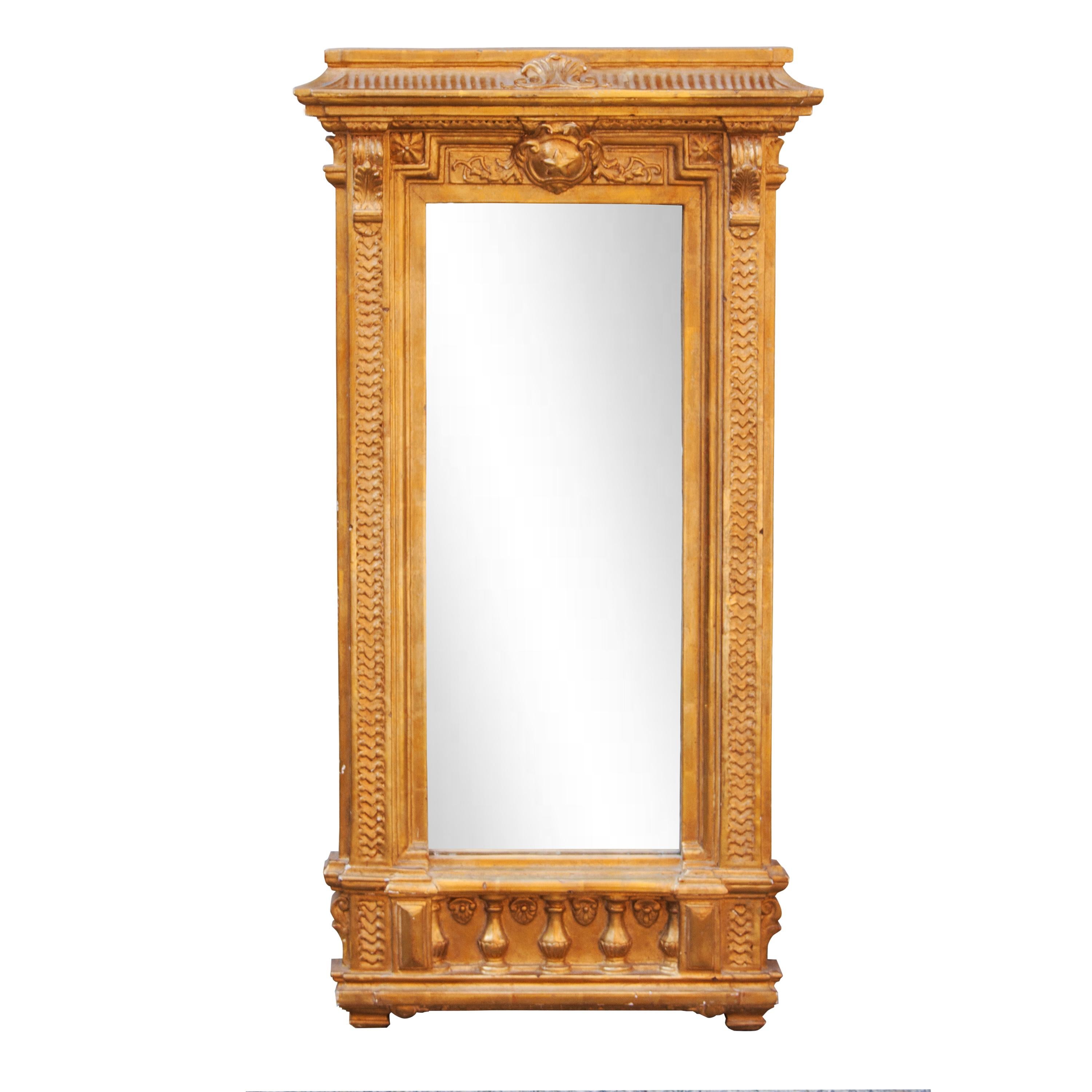 Neoclassical Empire style handcrafted mirror. Rectangular hand carved wooden structure with gold foiled finished.