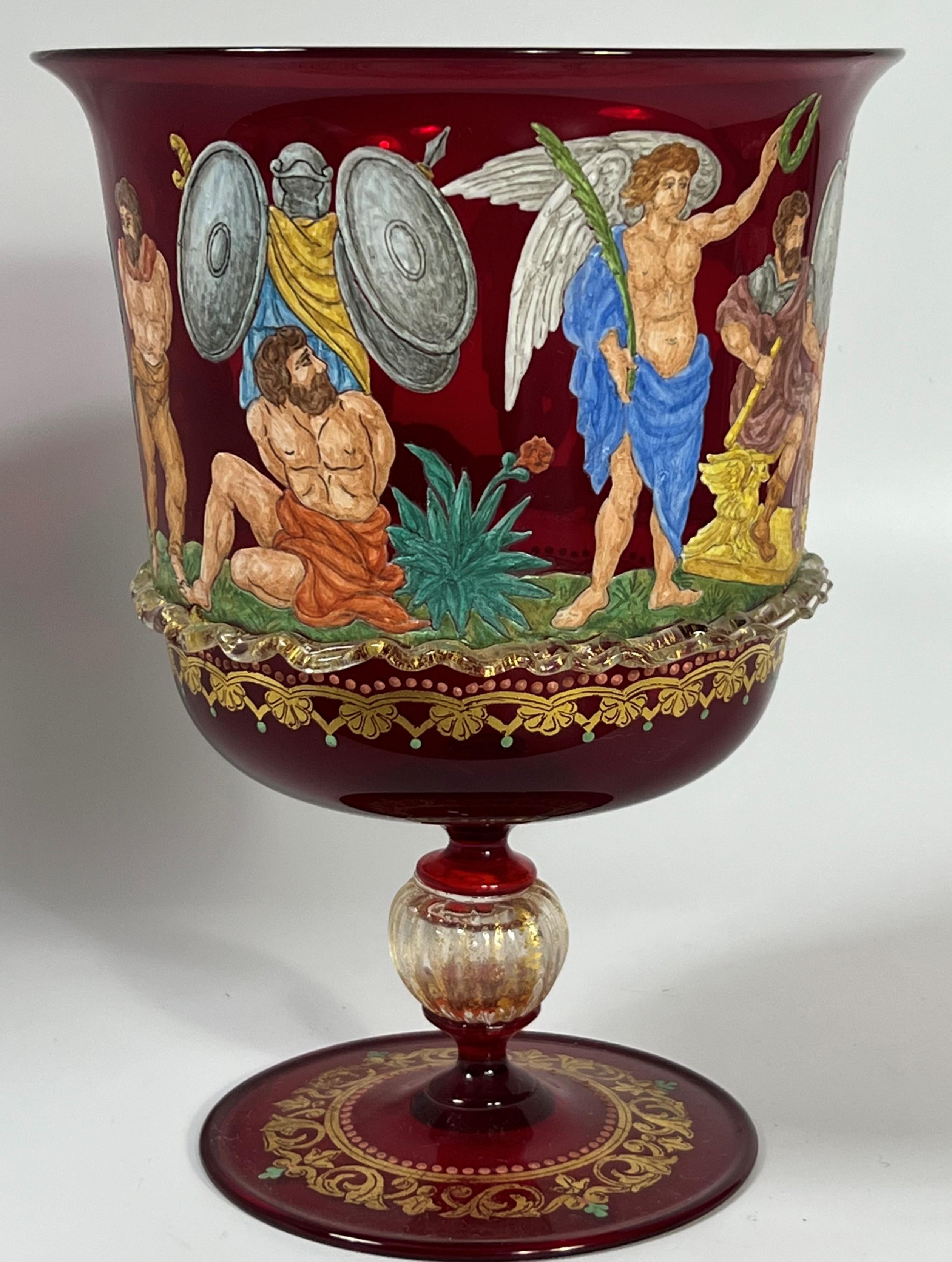 This chalice features a post battle enamel painted scene with a laural being placed upon the seated victor and a man pleads for mercy on behalf of defeated warriors and a family.  The quality of the Renaissance style painted enamel and depth of
