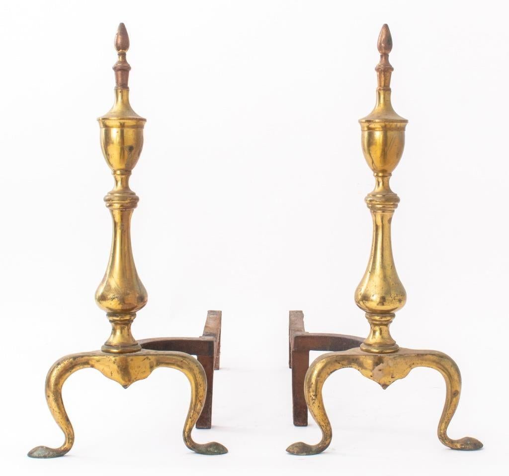 Neoclassical Federal style pair of brass andirons with urn finial detail.  

Dealer: S138XX