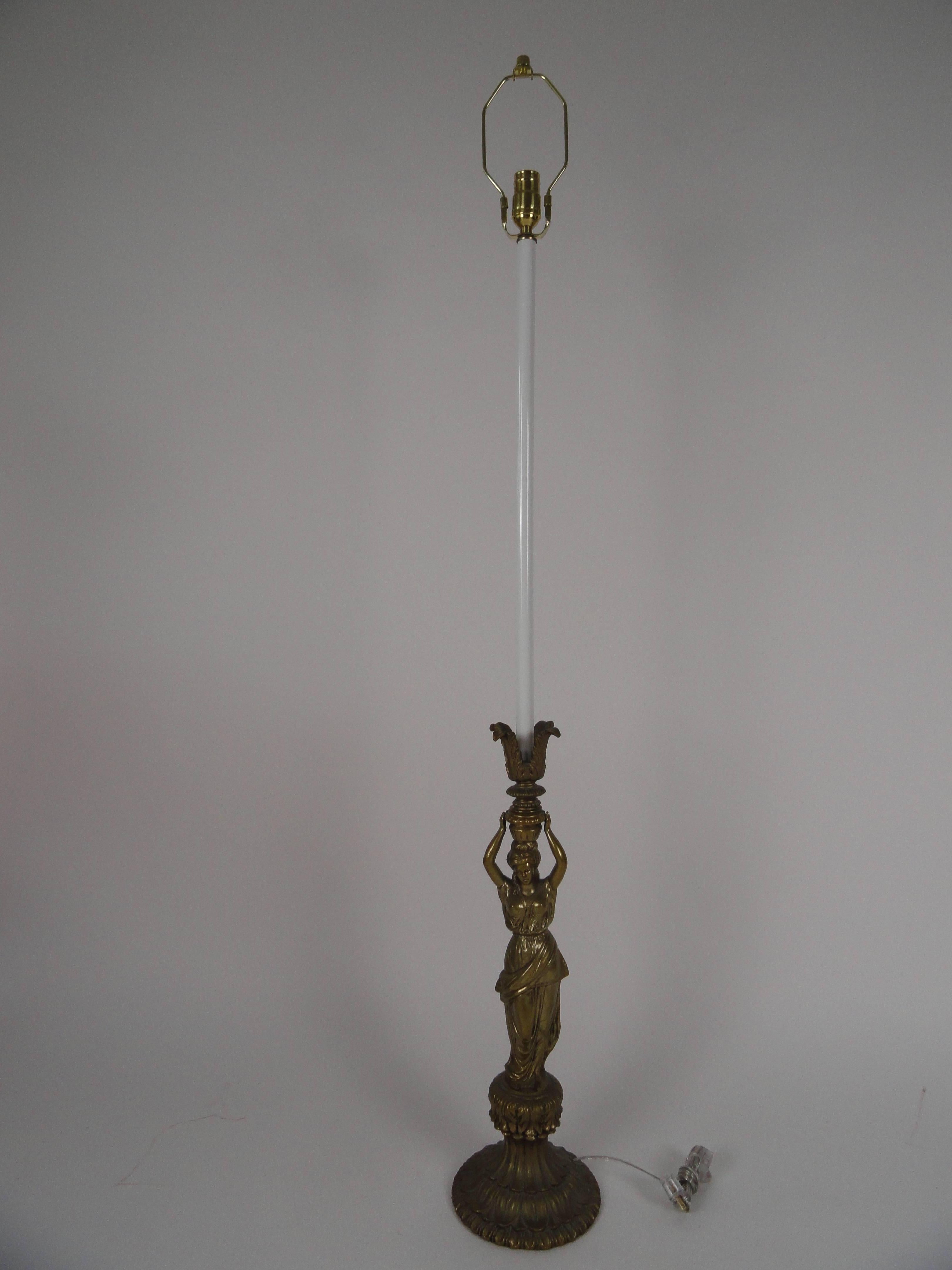 Neoclassical style metal female figure candlestick lamp. Rewired with inline switch. 
This is a tall lamp. Measures: height is 48
