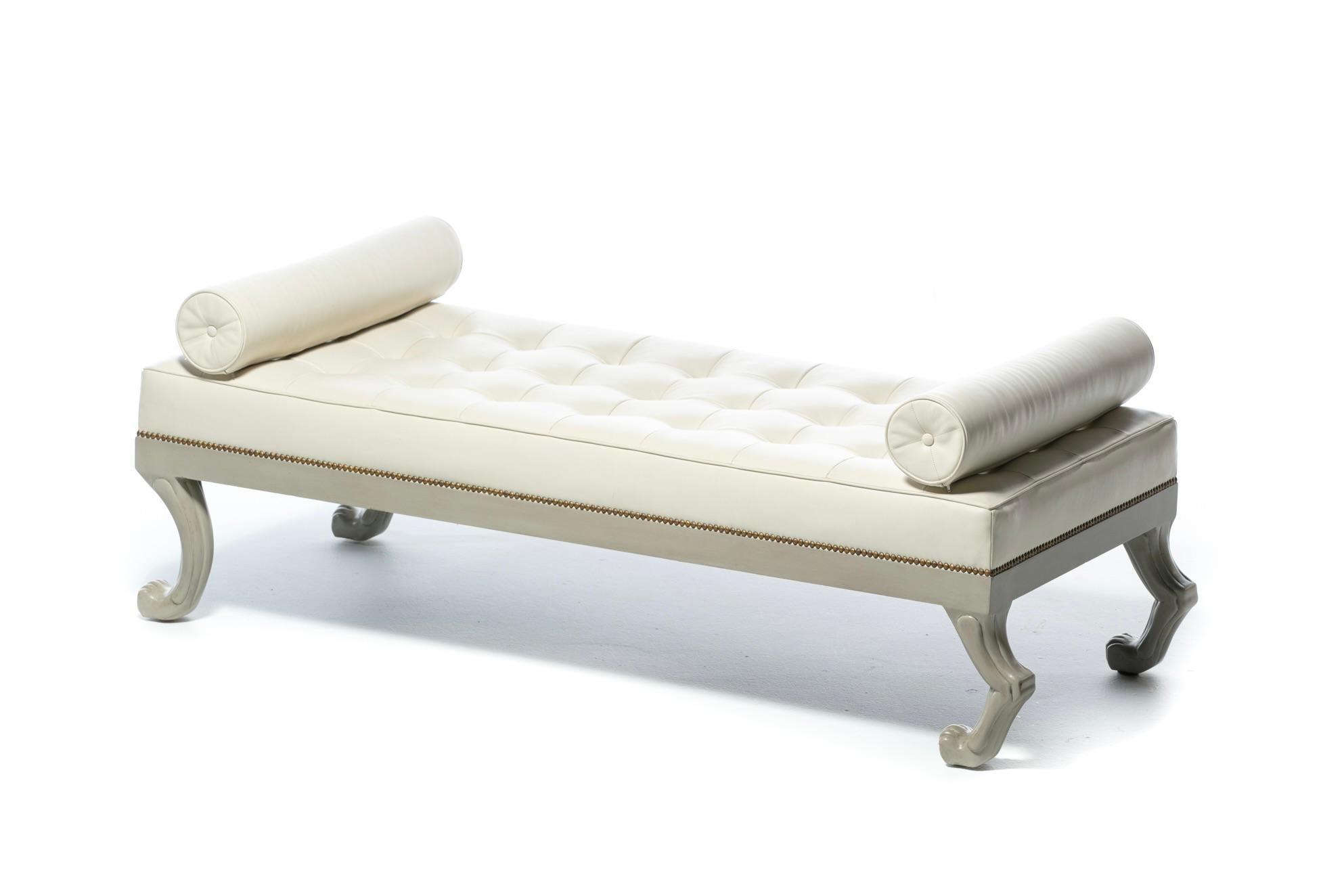 Elegant and whimsical French style Neoclassical Daybed upholstered in tufted Ivory White Leather with matching magnetic stationary Bolster Pillows. Lots of details to admire. Leather squares are individually stitched and tufted for uniformity with