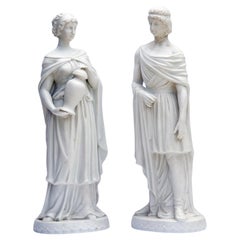 Neoclassical German White Bisque Figurines; a pair.