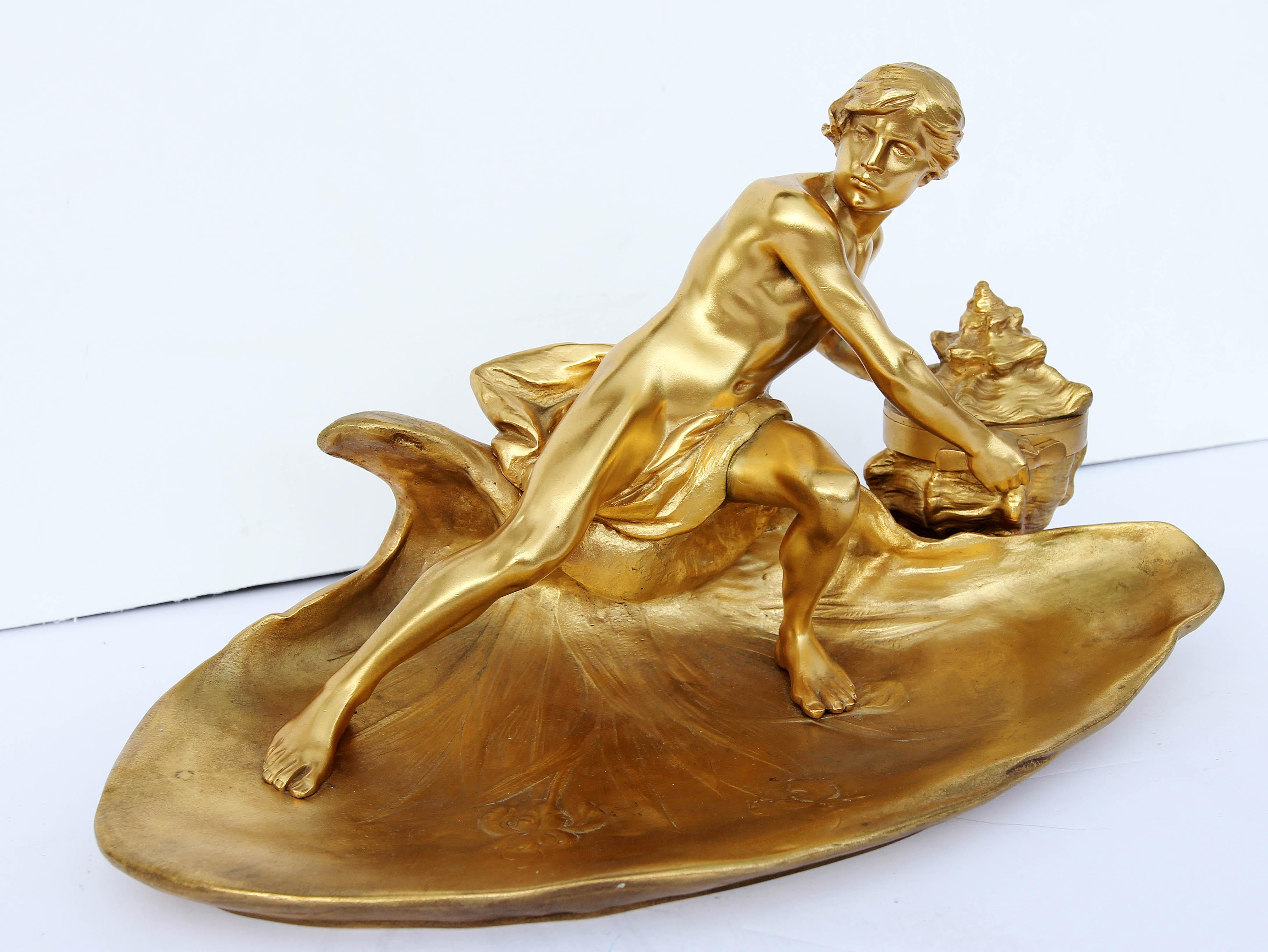 Neoclassical inkwell with a sculpture of a young Neptune holding a seashell. French gilt bronze, late 19th century.