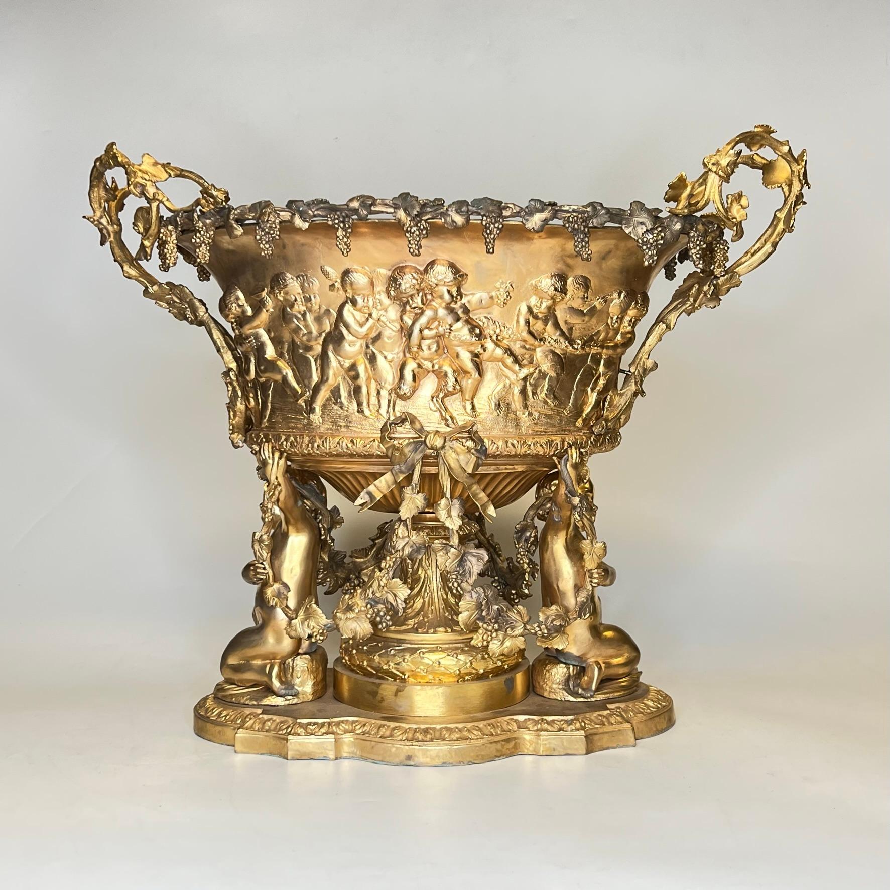 Neoclassical gilt bronze centerpiece or planter with Bacchus motif depicting frolicking cherubs (putti) in procession.  