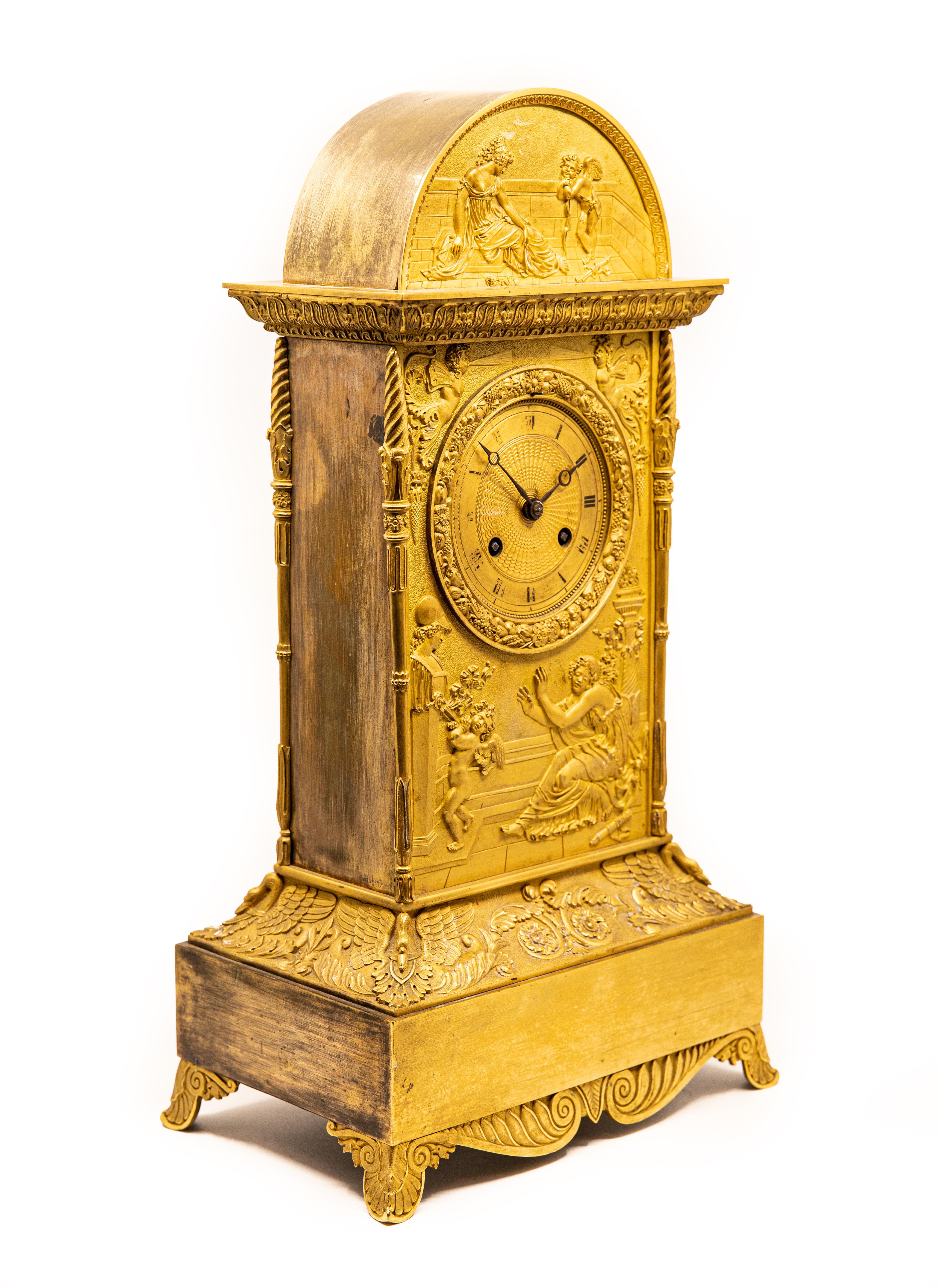 Neoclassical gilt bronze with bas-relief allegorical scene with cupid bound to a statue and a maiden motif ormolu mantel clock, dial with painted Roman numerals, movement marked: 